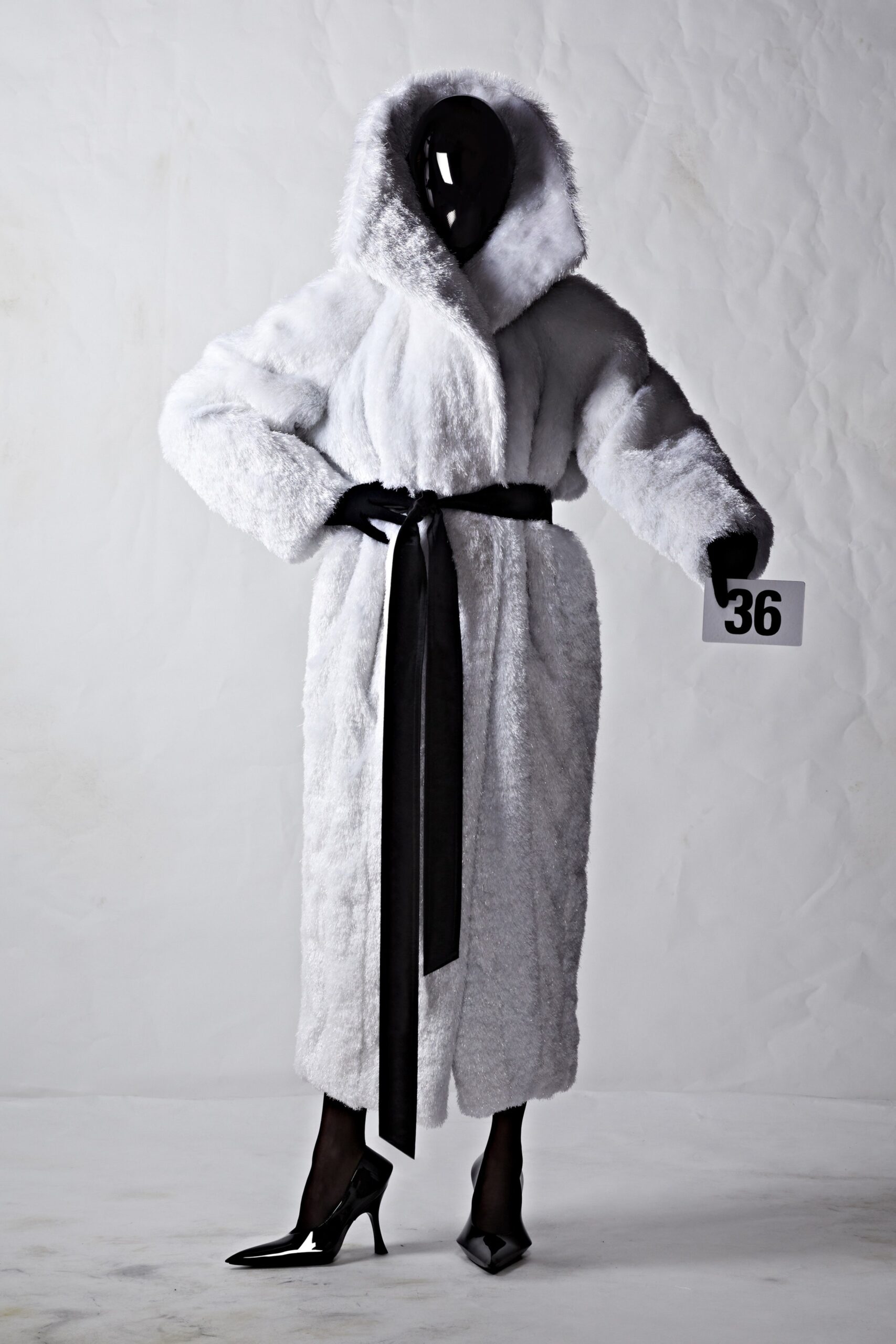 white faux-fur belted coat with black shoes