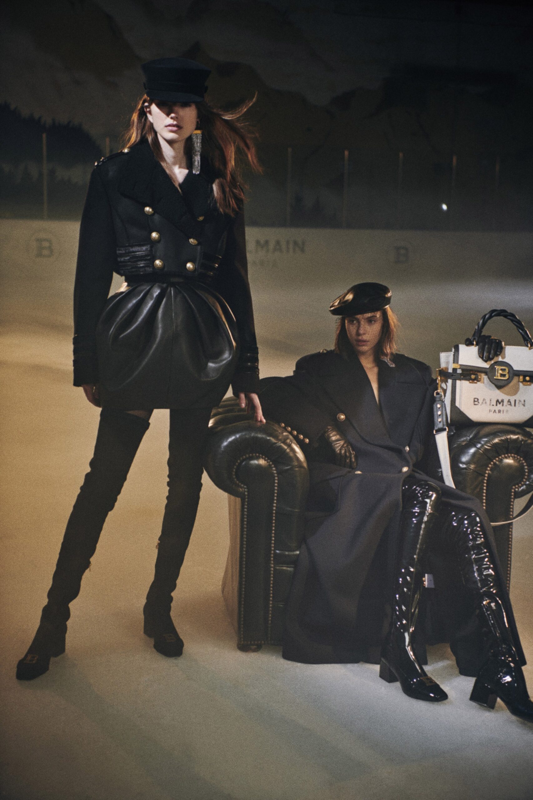 black fitted coat and leather pants