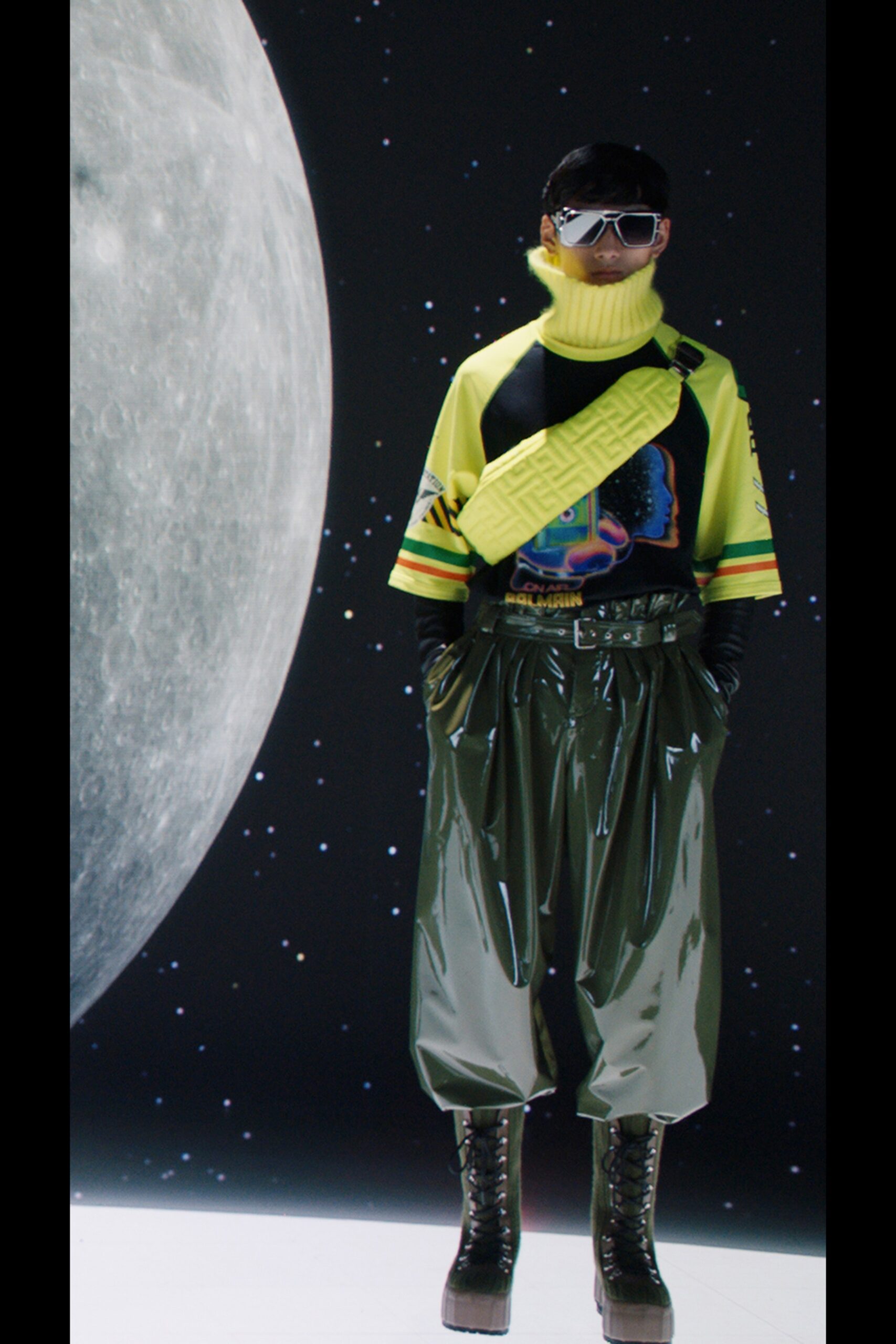 yellow printed top with green vinyl pants