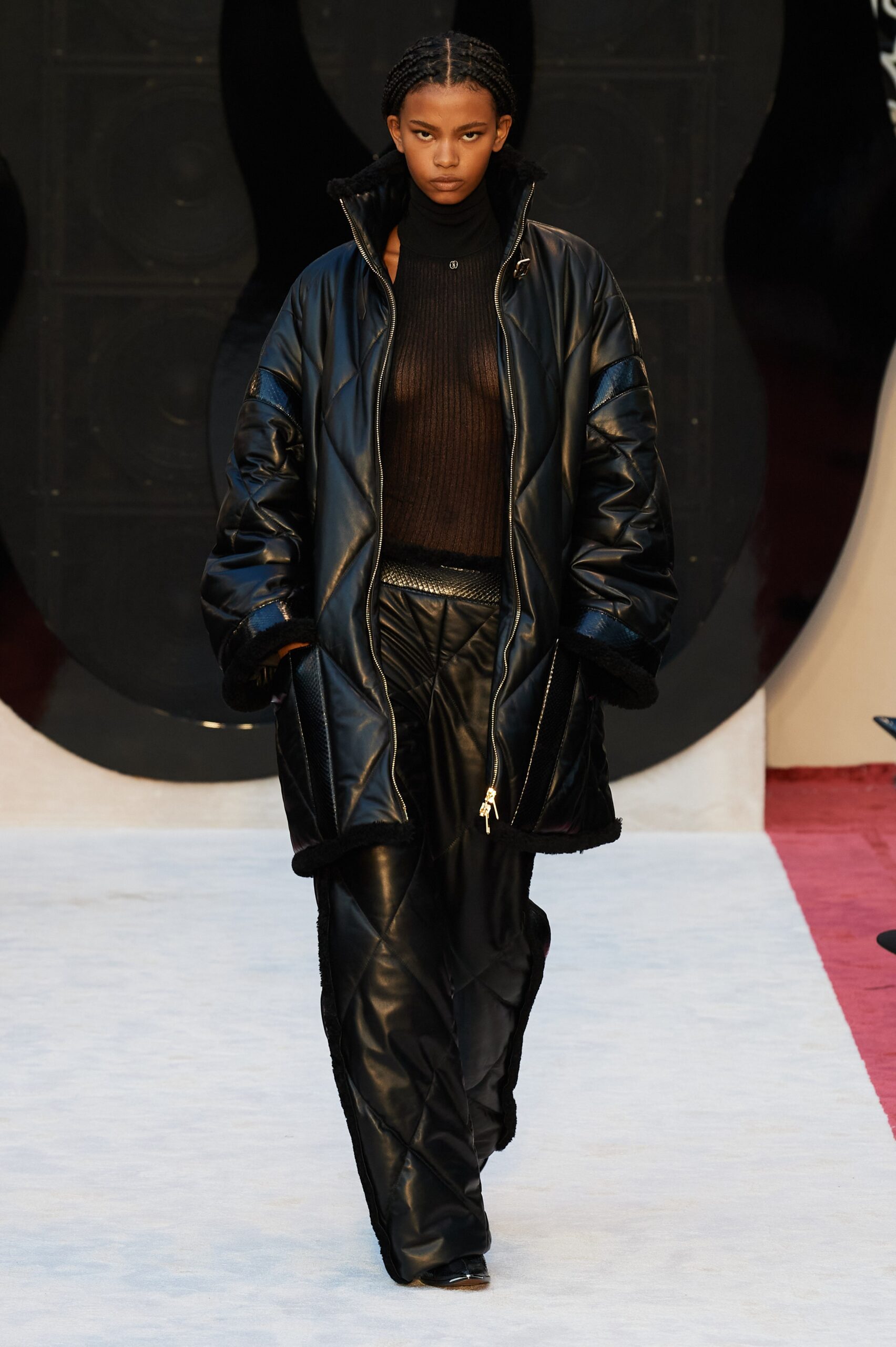 black oversized leather coat with fitted top