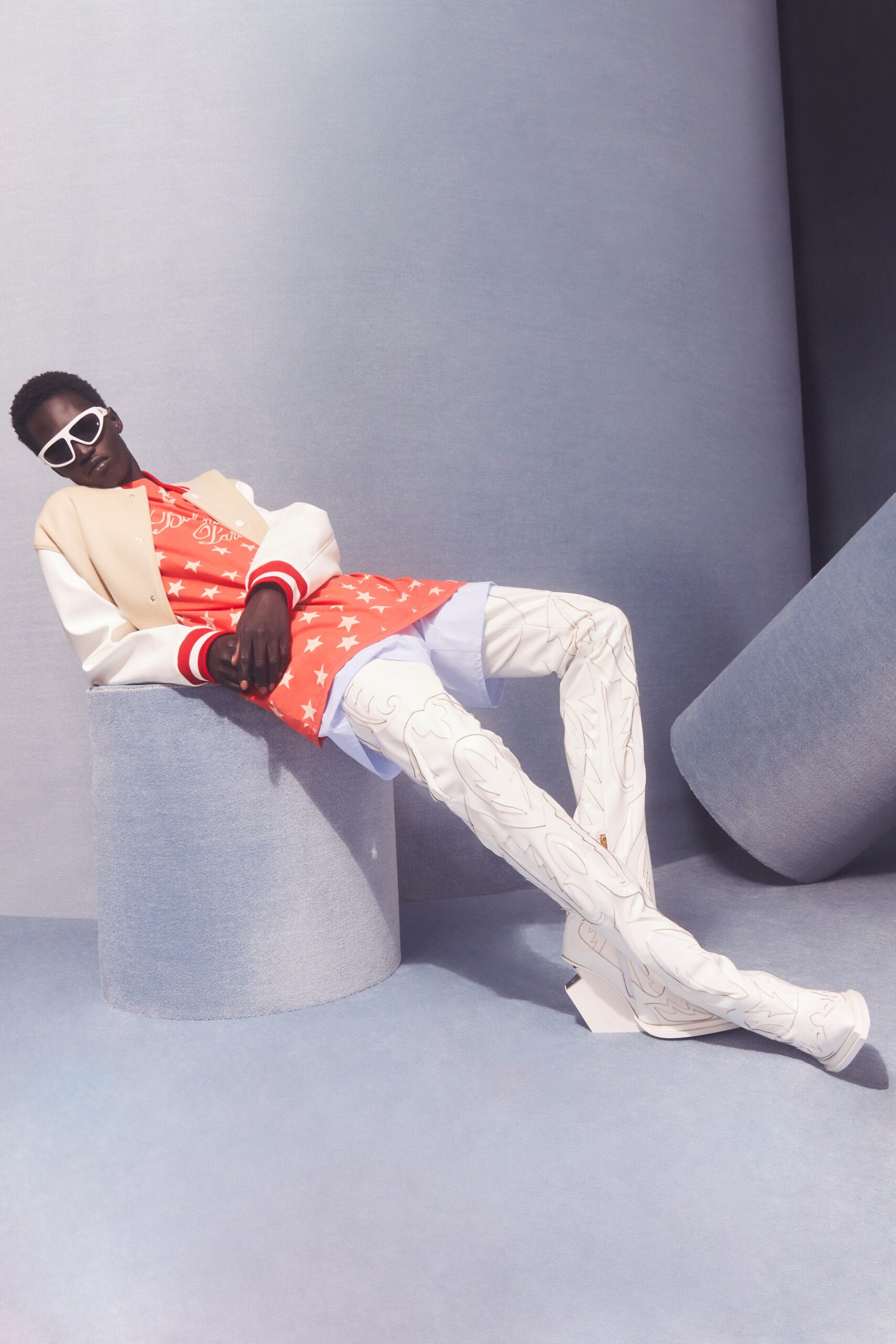 red printed top with oversized beige jacket