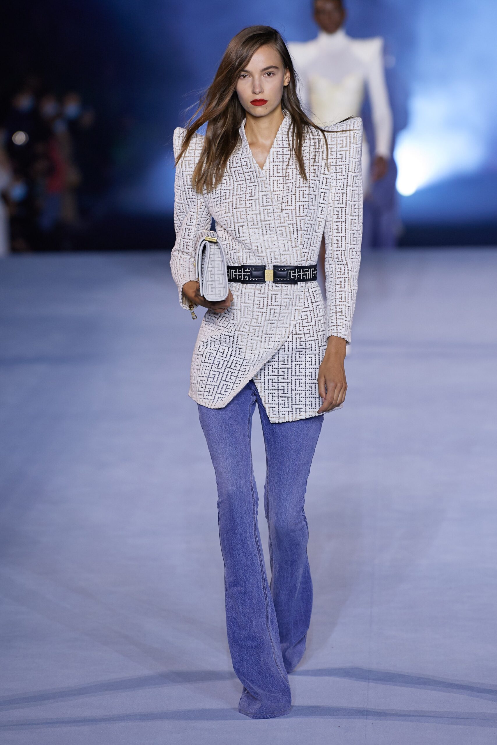 white printed tailored blazer and blue denim pants