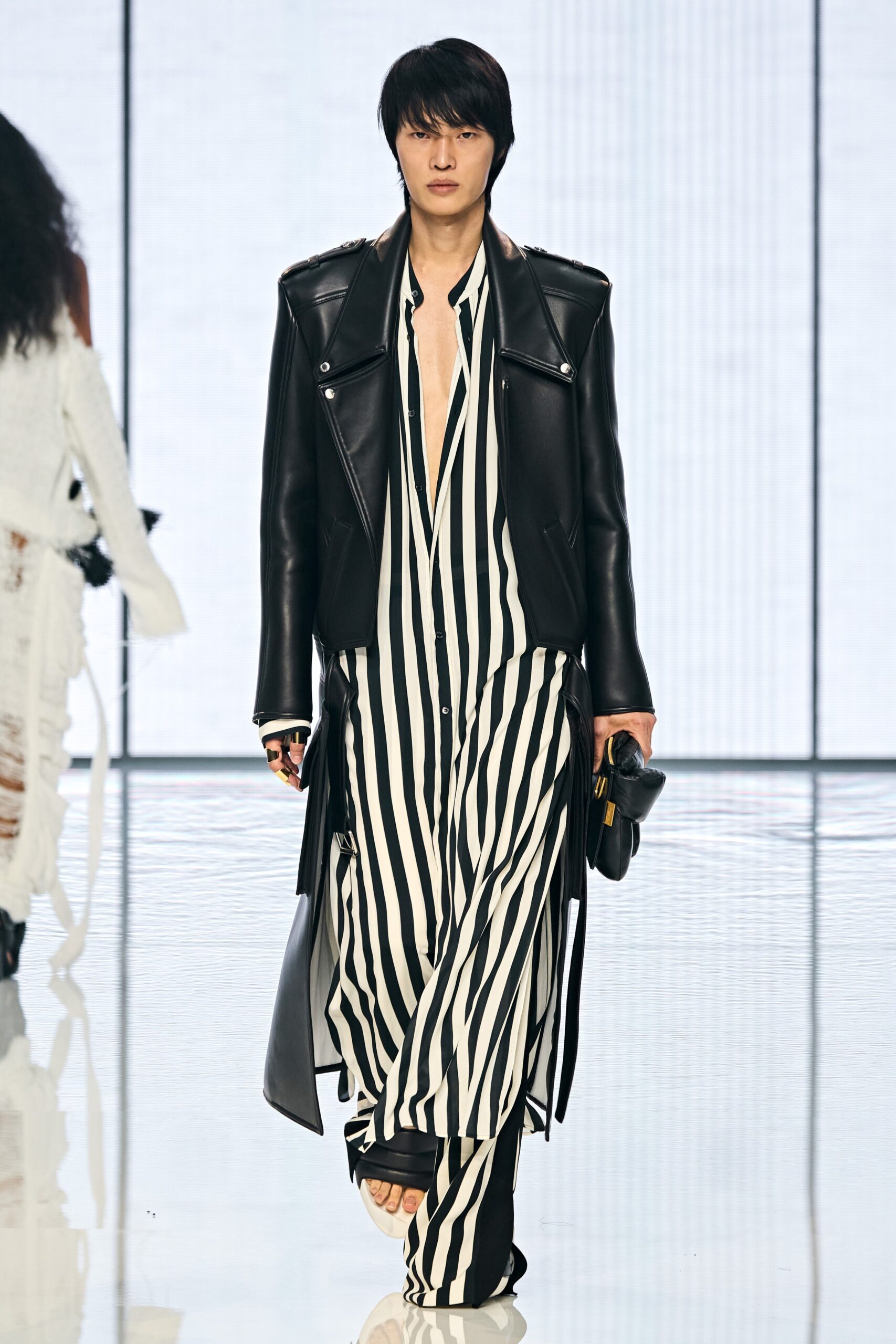 black leather coat and striped dress