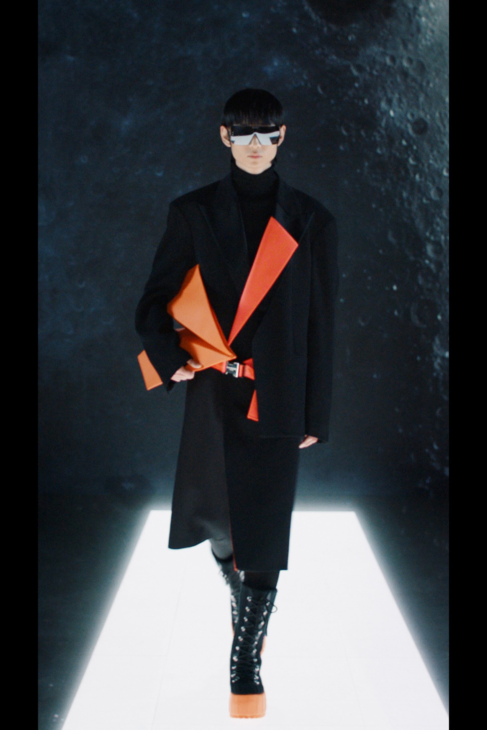 black wool fitted coat with orange bag