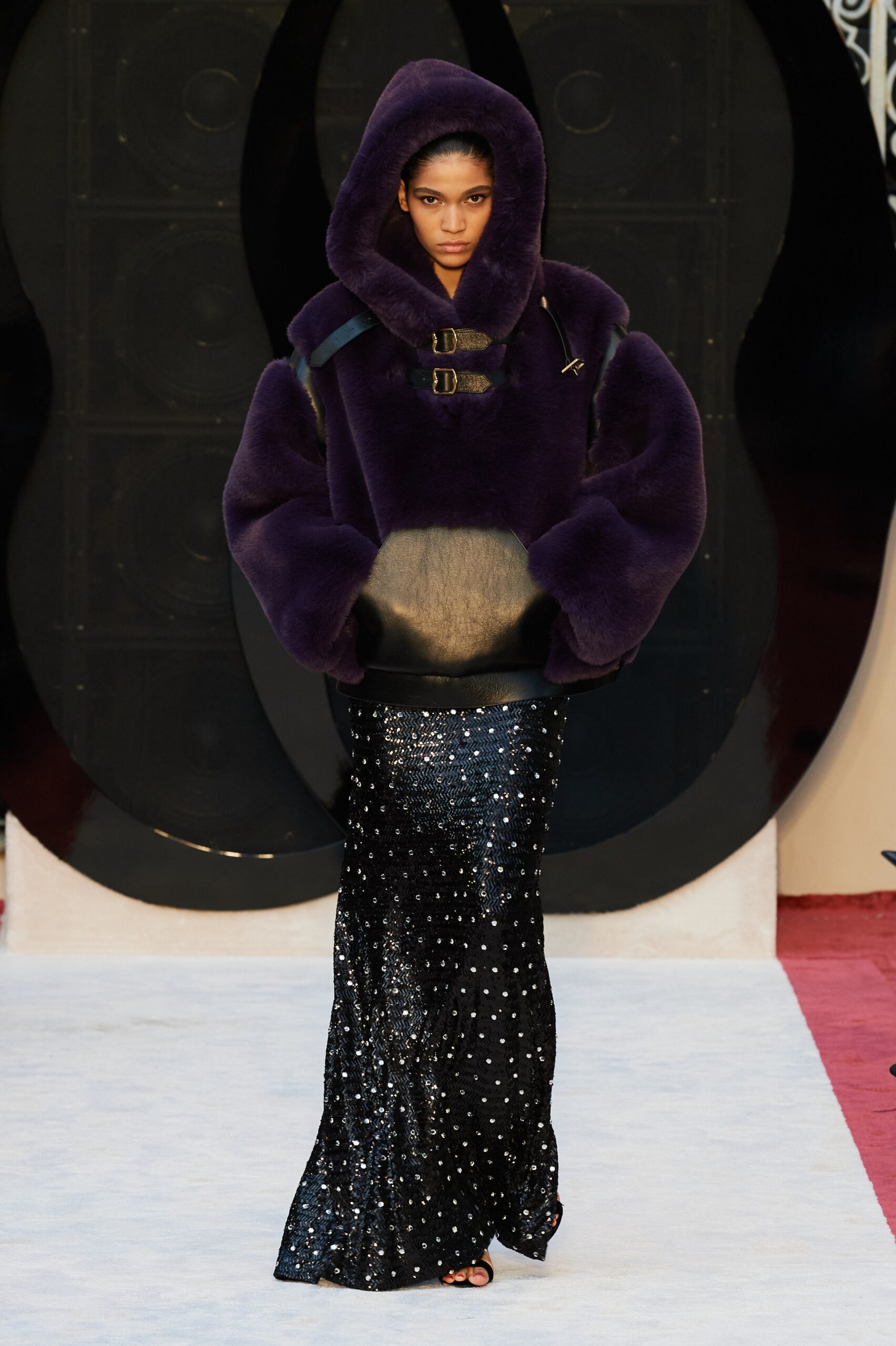 purple fur oversized jacket and black sequin skirt
