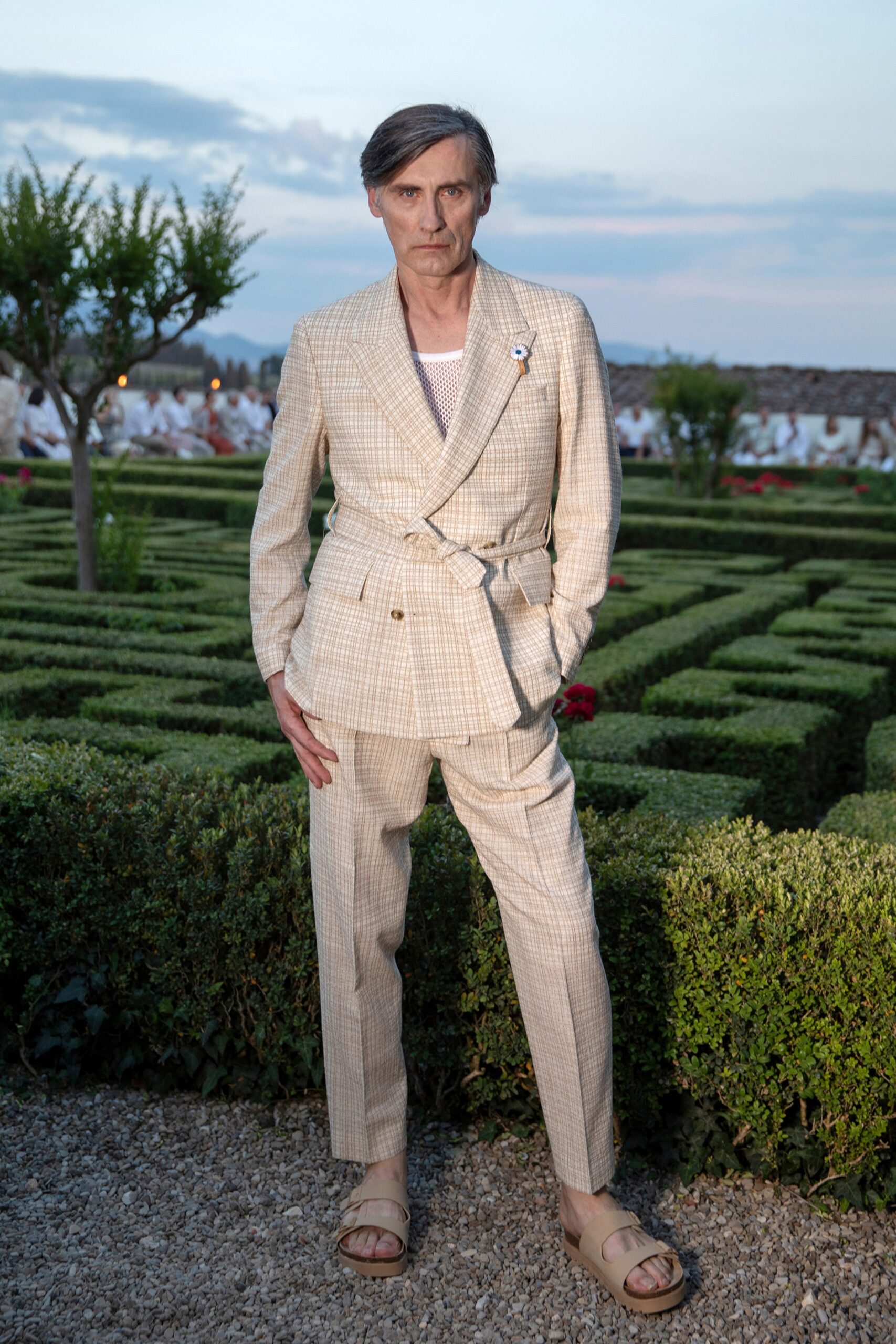beige tailored suit with flat shoes