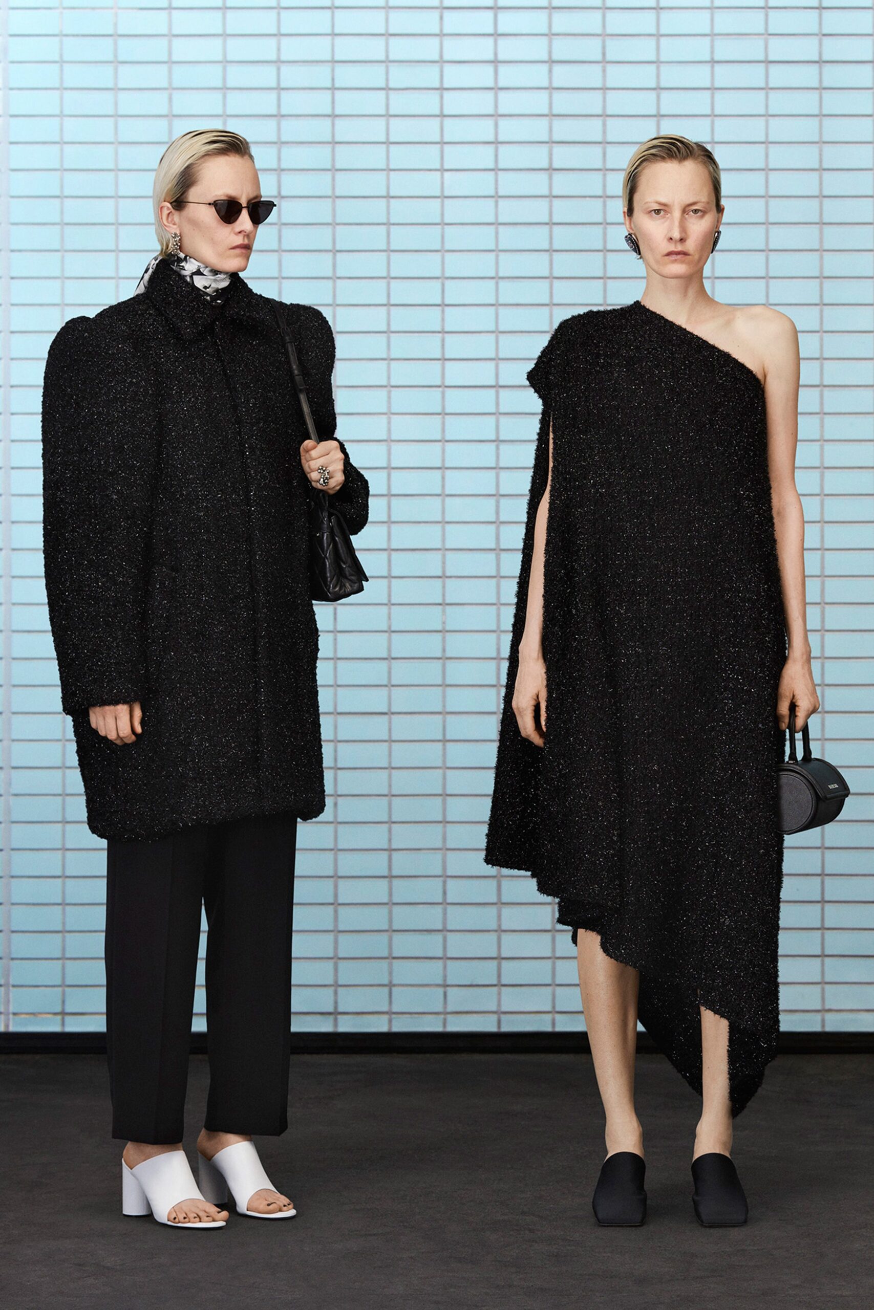 black oversized coat and asymmetric dress