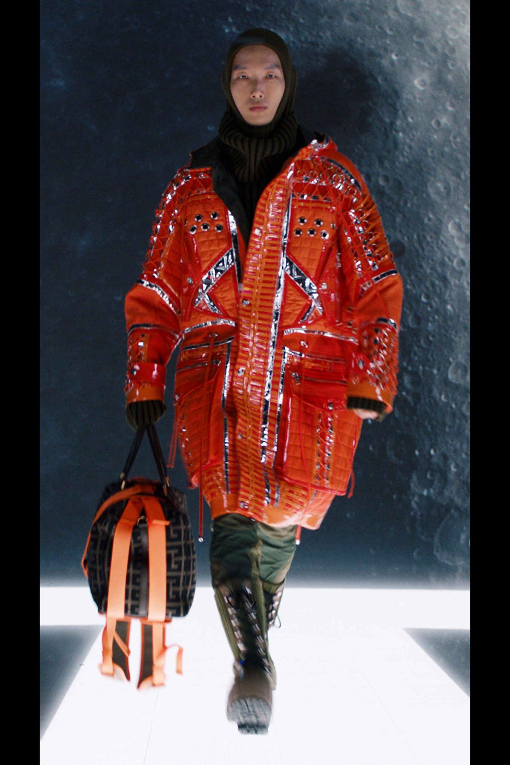 orange vinyl parka with green pants