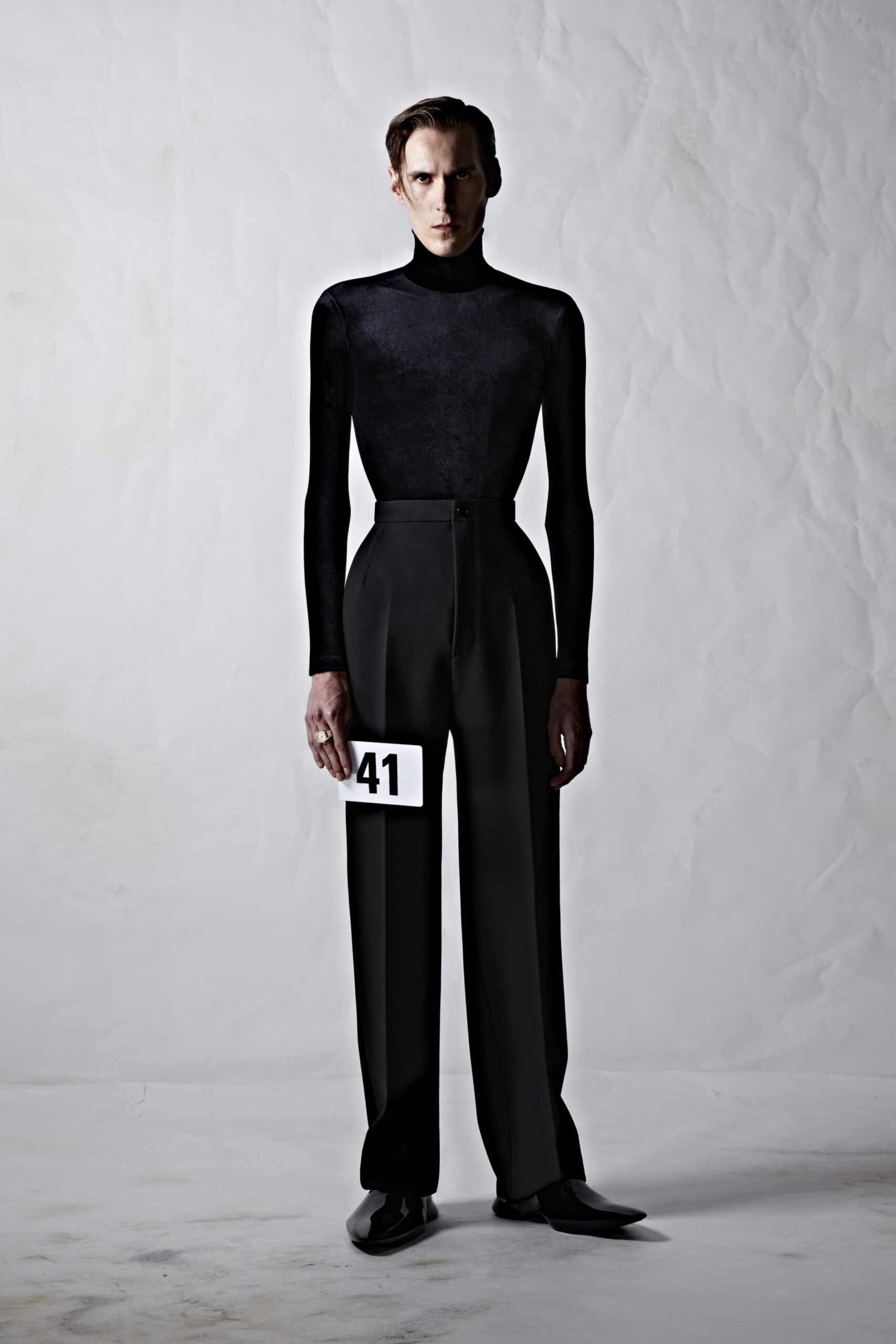 black velvet turtleneck top and tailored pants