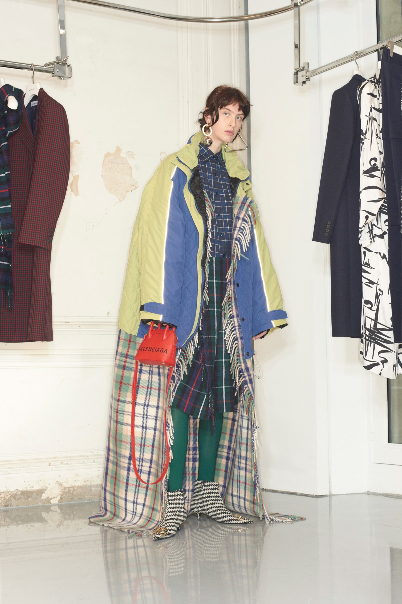 layered green coat with plaid dress