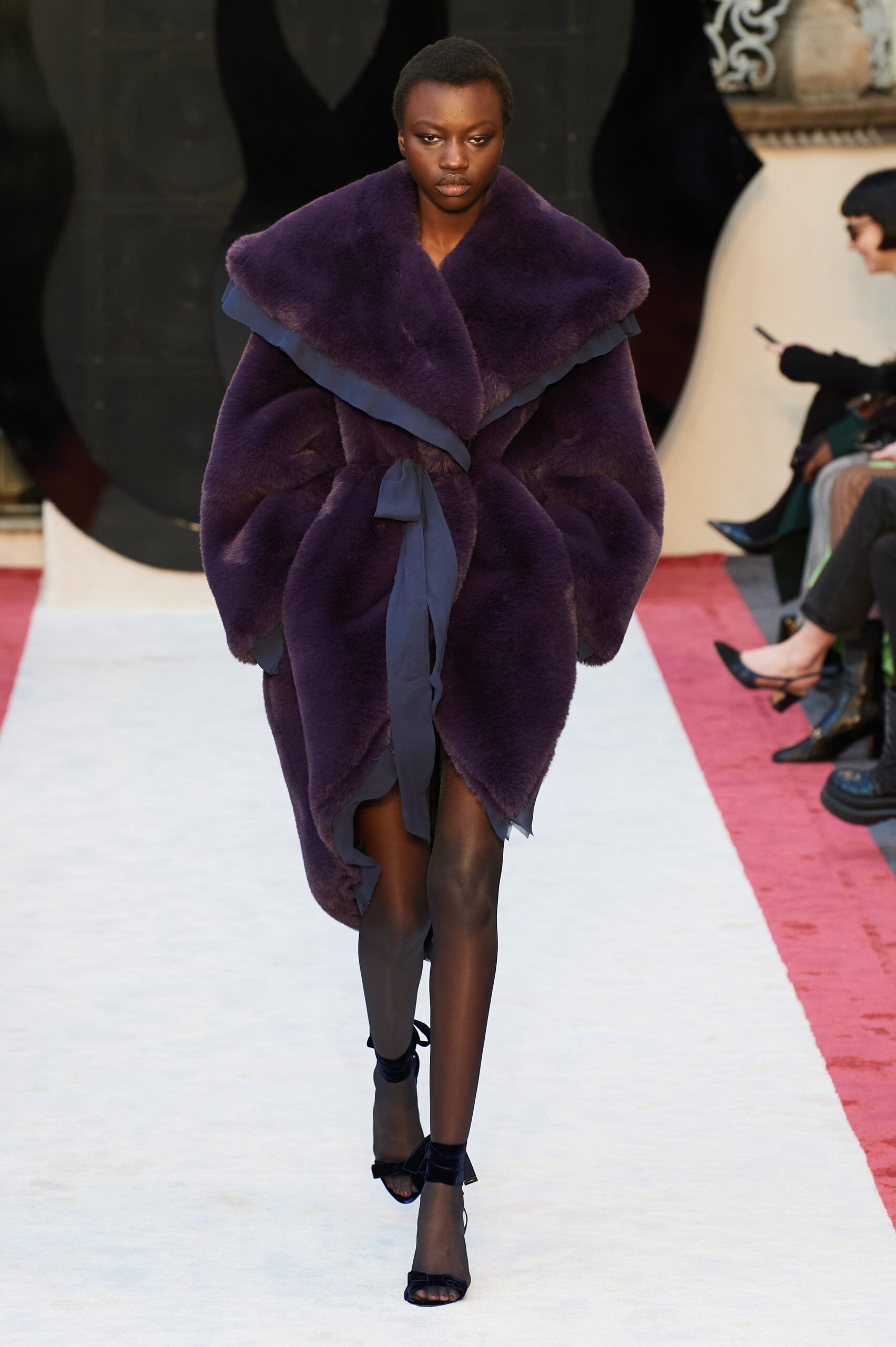 purple faux-fur coat with strappy shoes