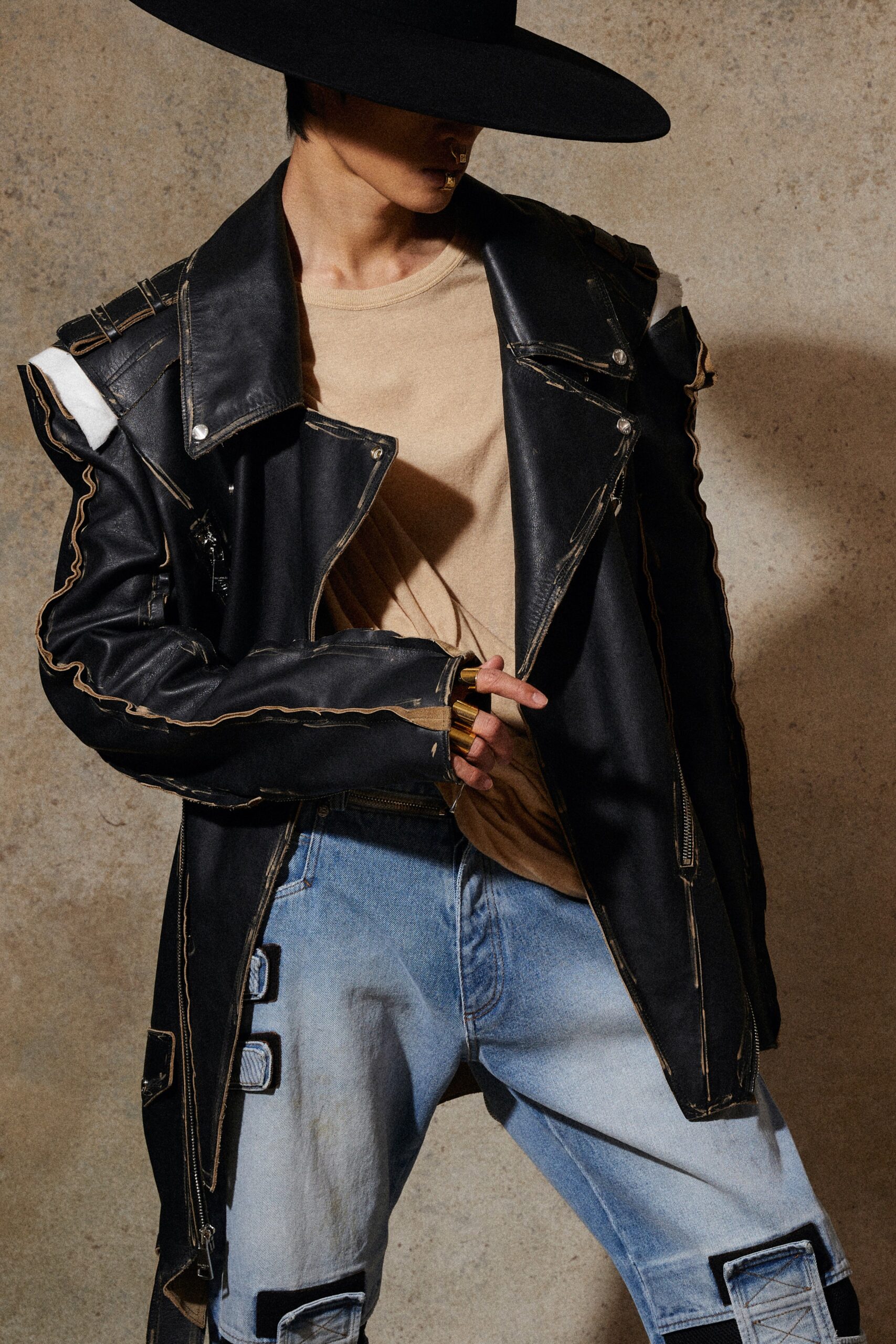 black leather long-sleeve collared oversized zippered buttoned jacket