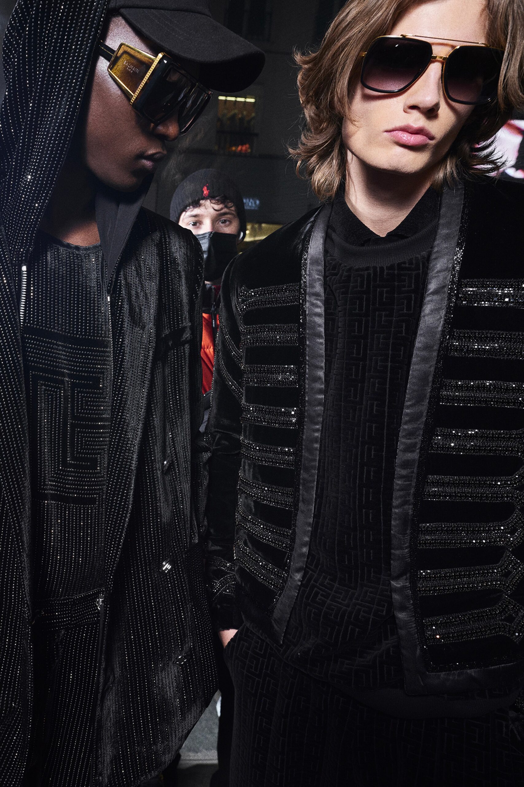 black fitted velvet jacket and relaxed hoodie