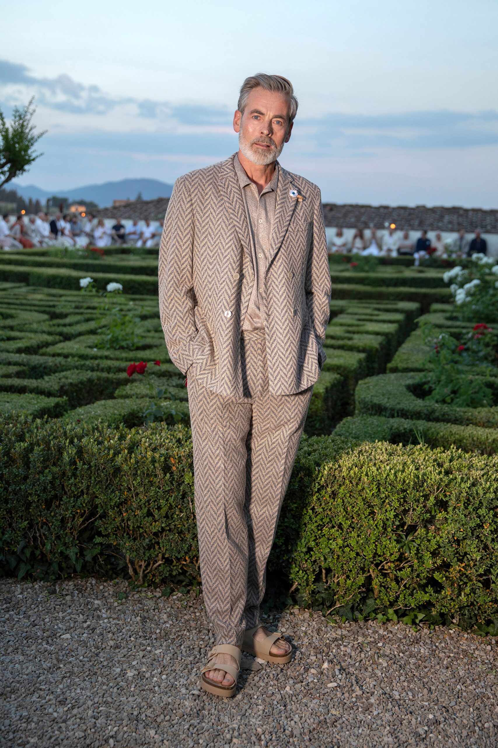 beige tailored suit with brown shoes
