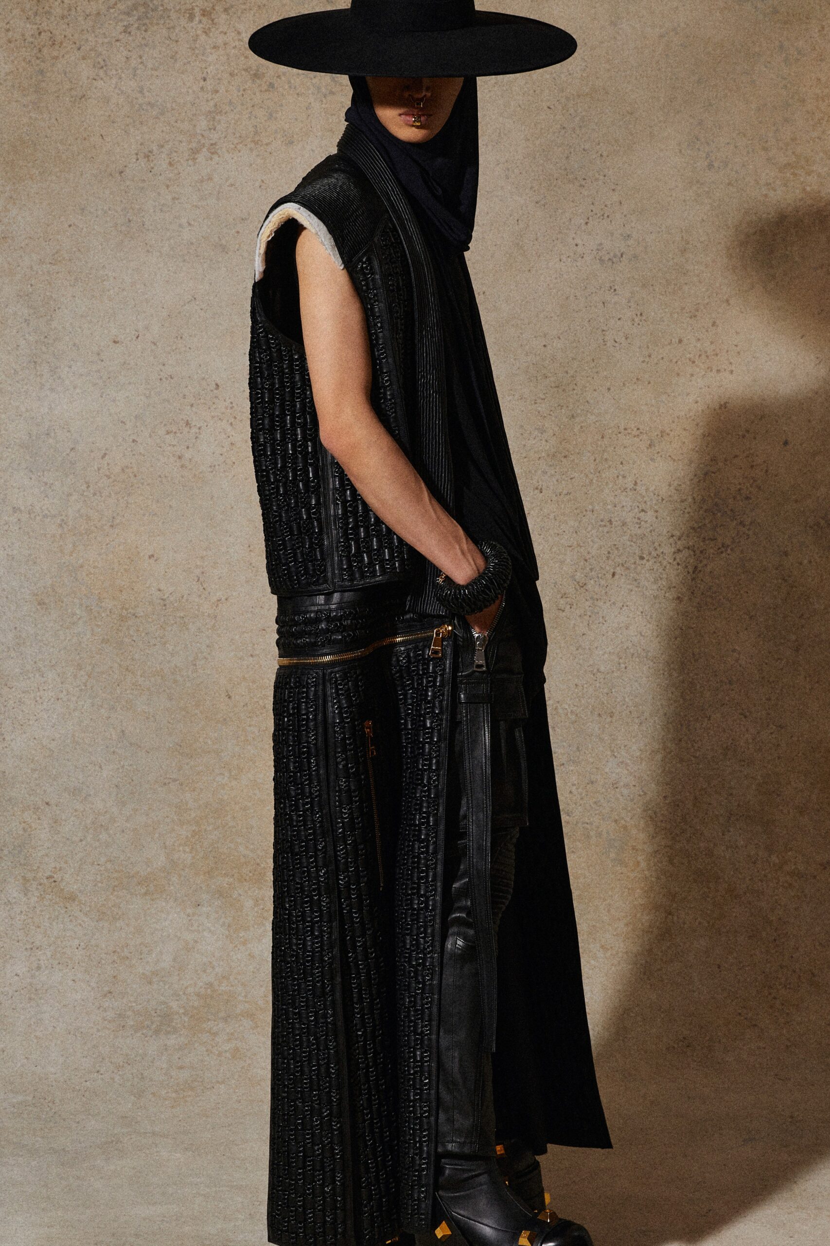 black leather sleeveless fitted pleated vest