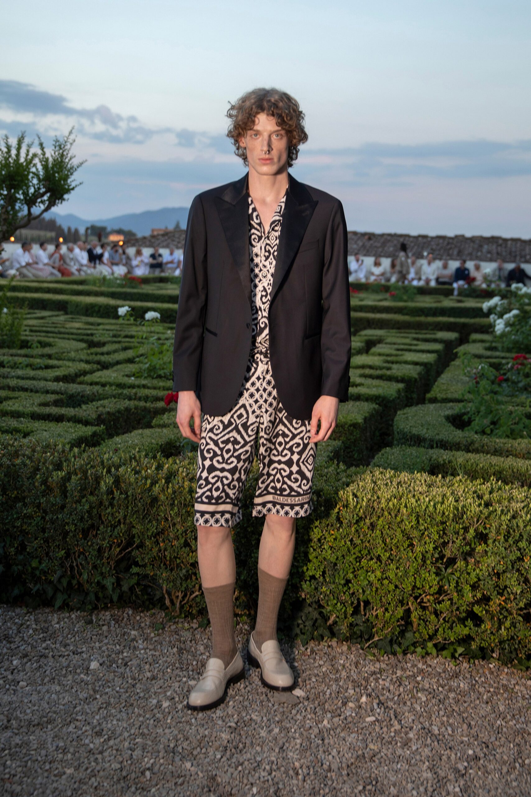 black tailored blazer with printed shirt and shorts