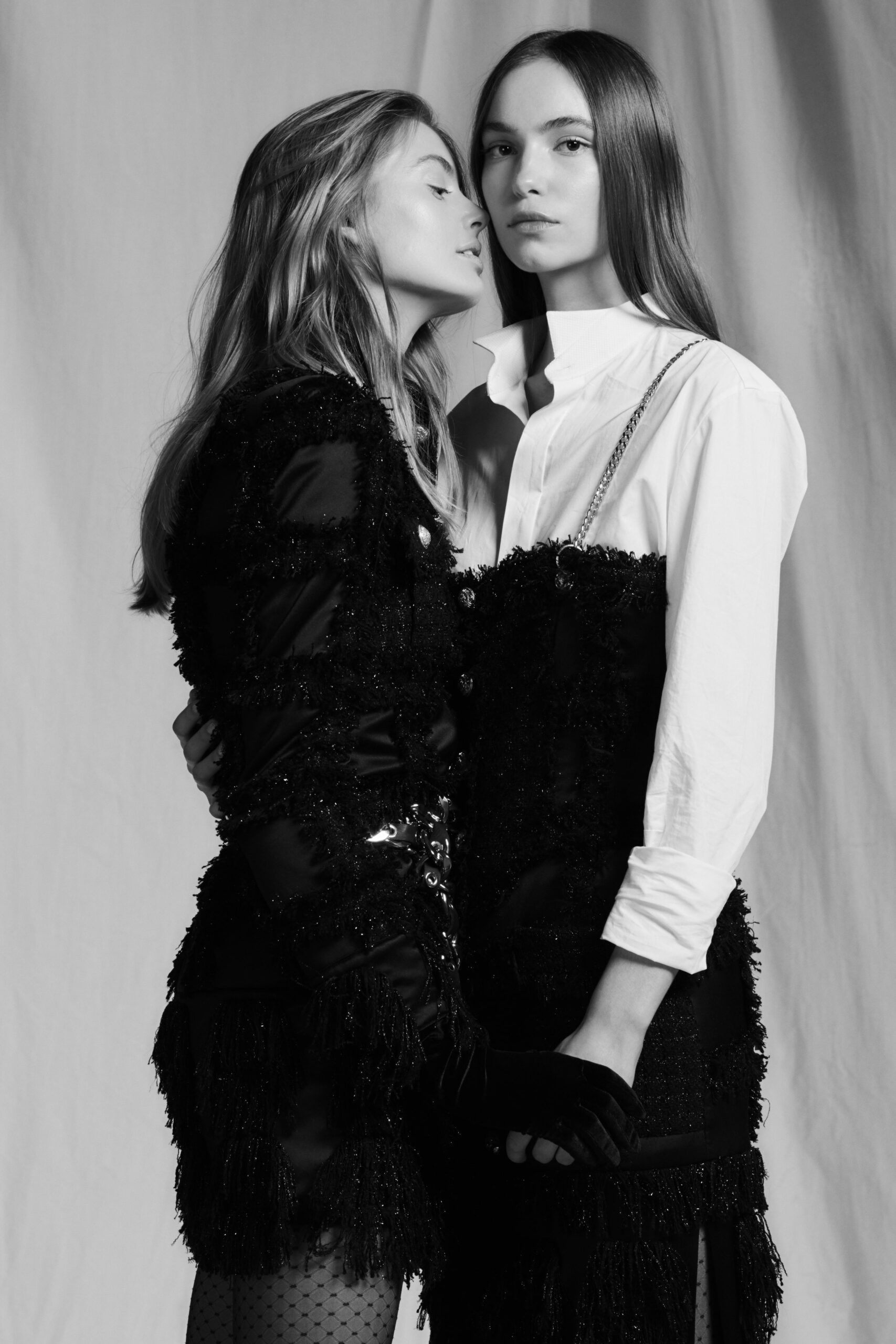 black fringed mini dress and white shirt