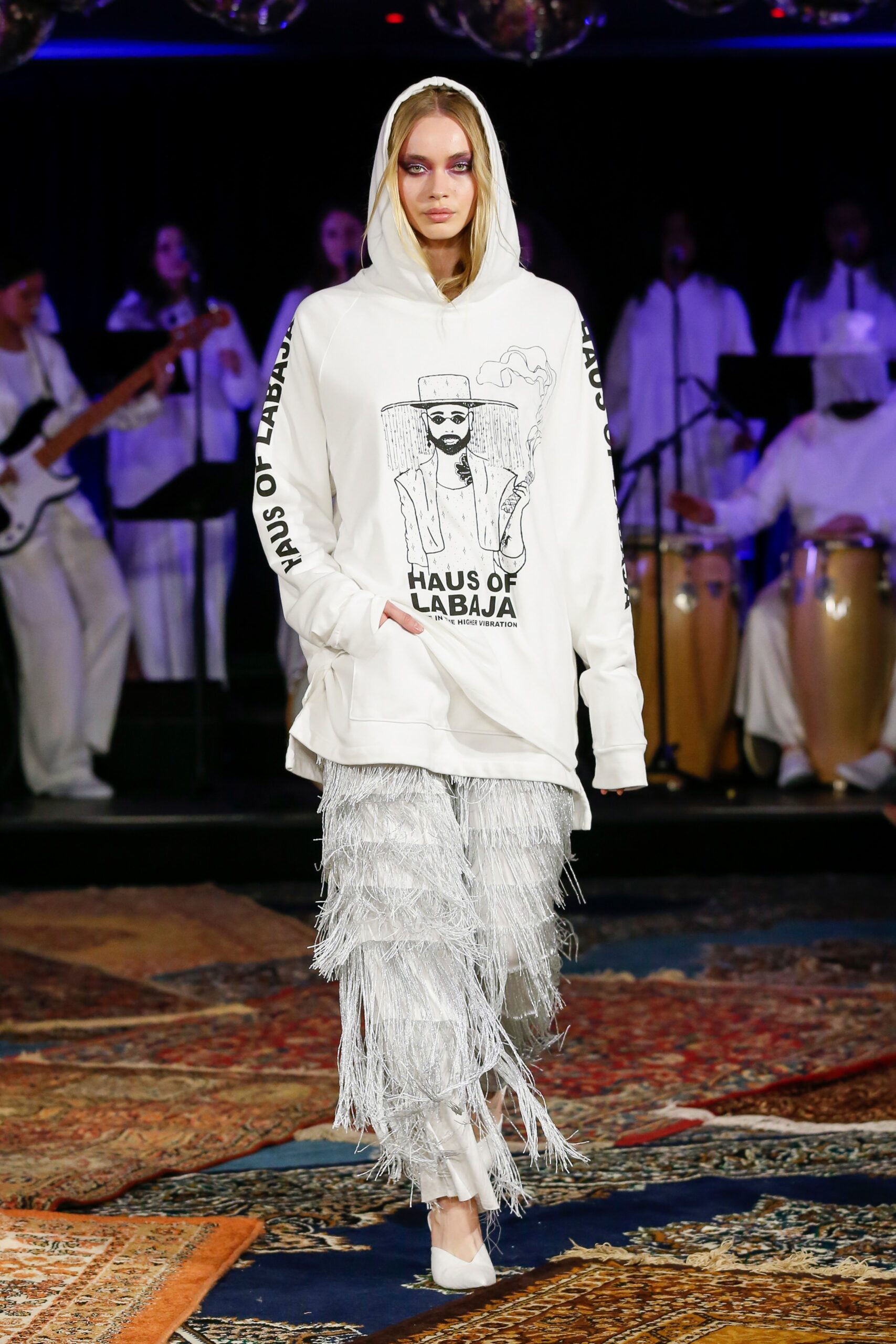 white hoodie with fringed pants
