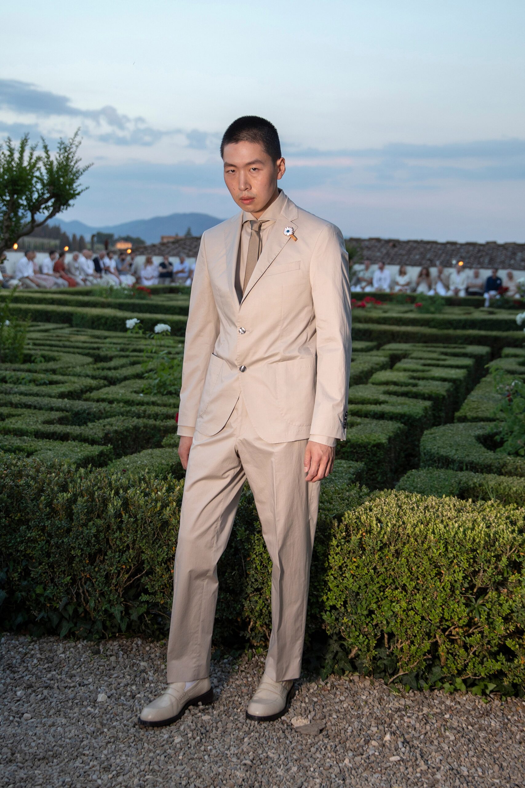 beige tailored suit with white shoes