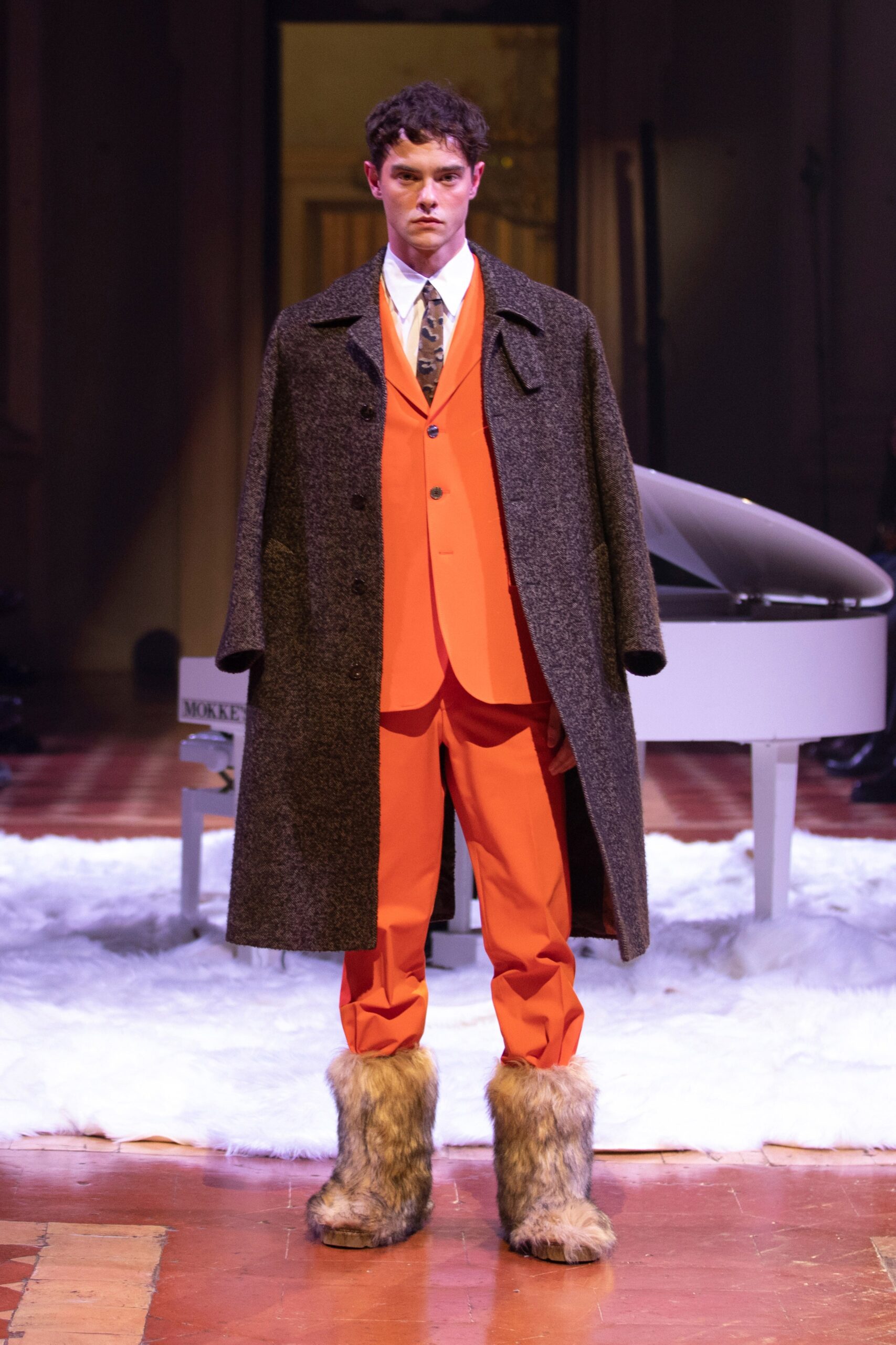 orange tailored suit with gray coat
