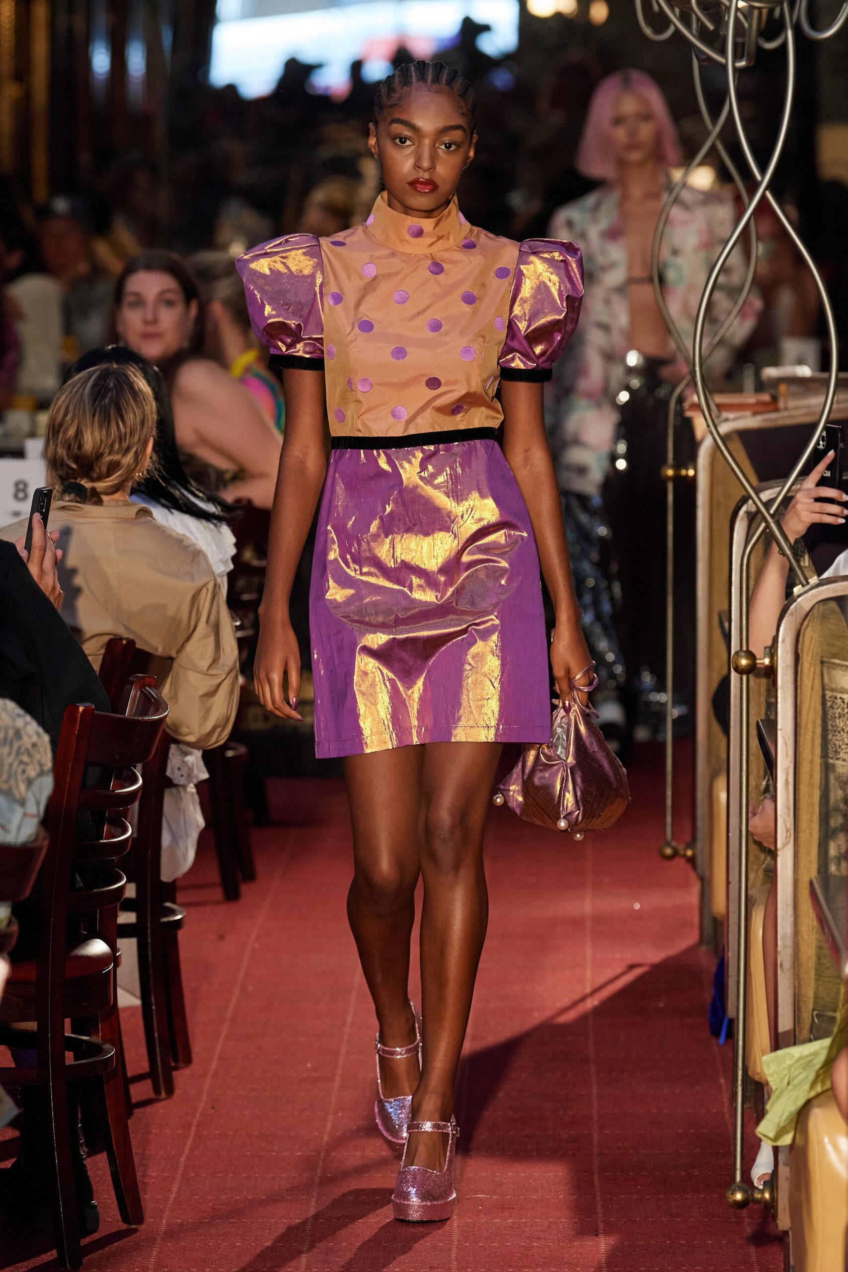 beige polka-dot top and purple mini skirt