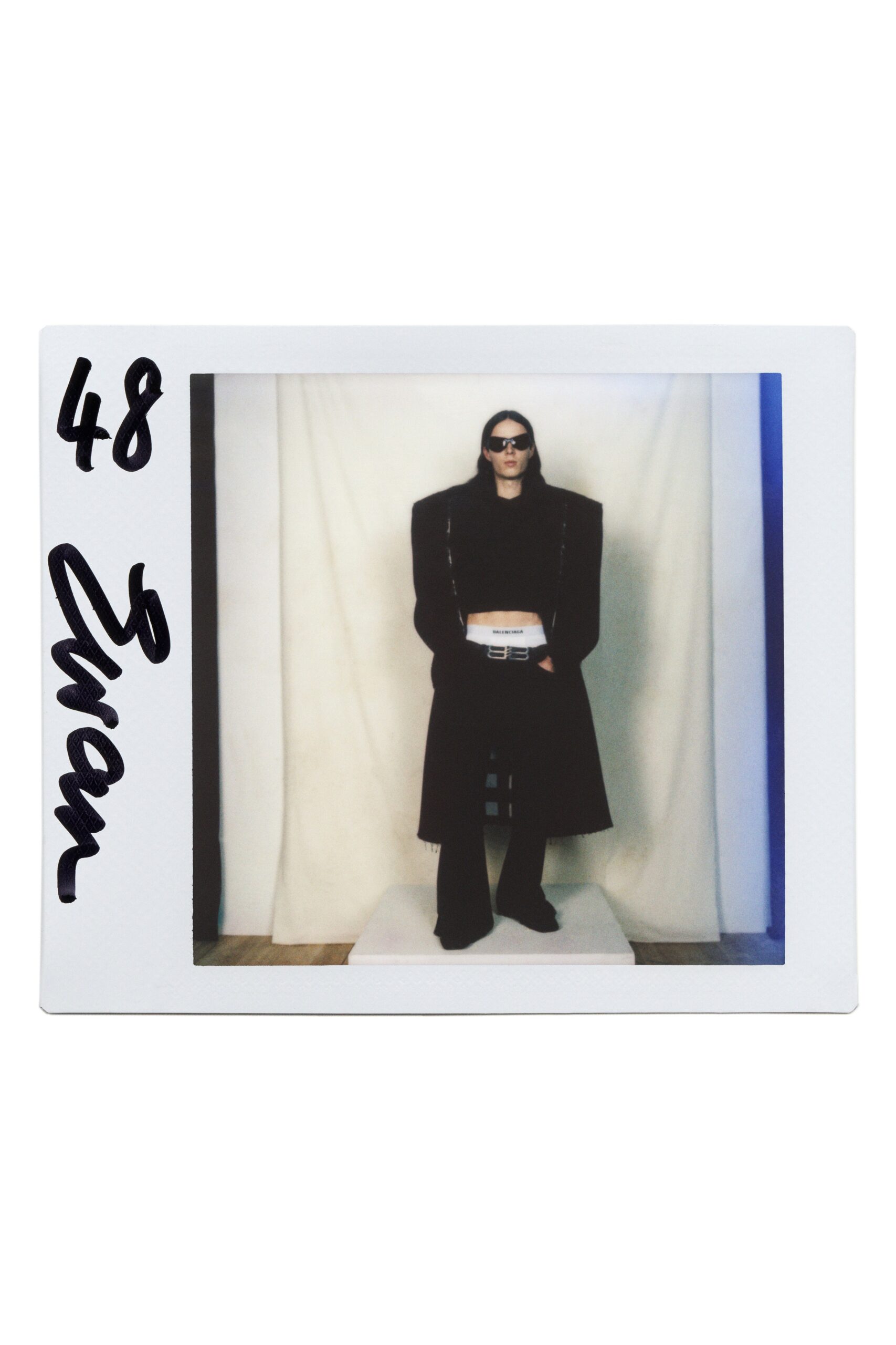 black wool long-sleeve collared oversized structured coat