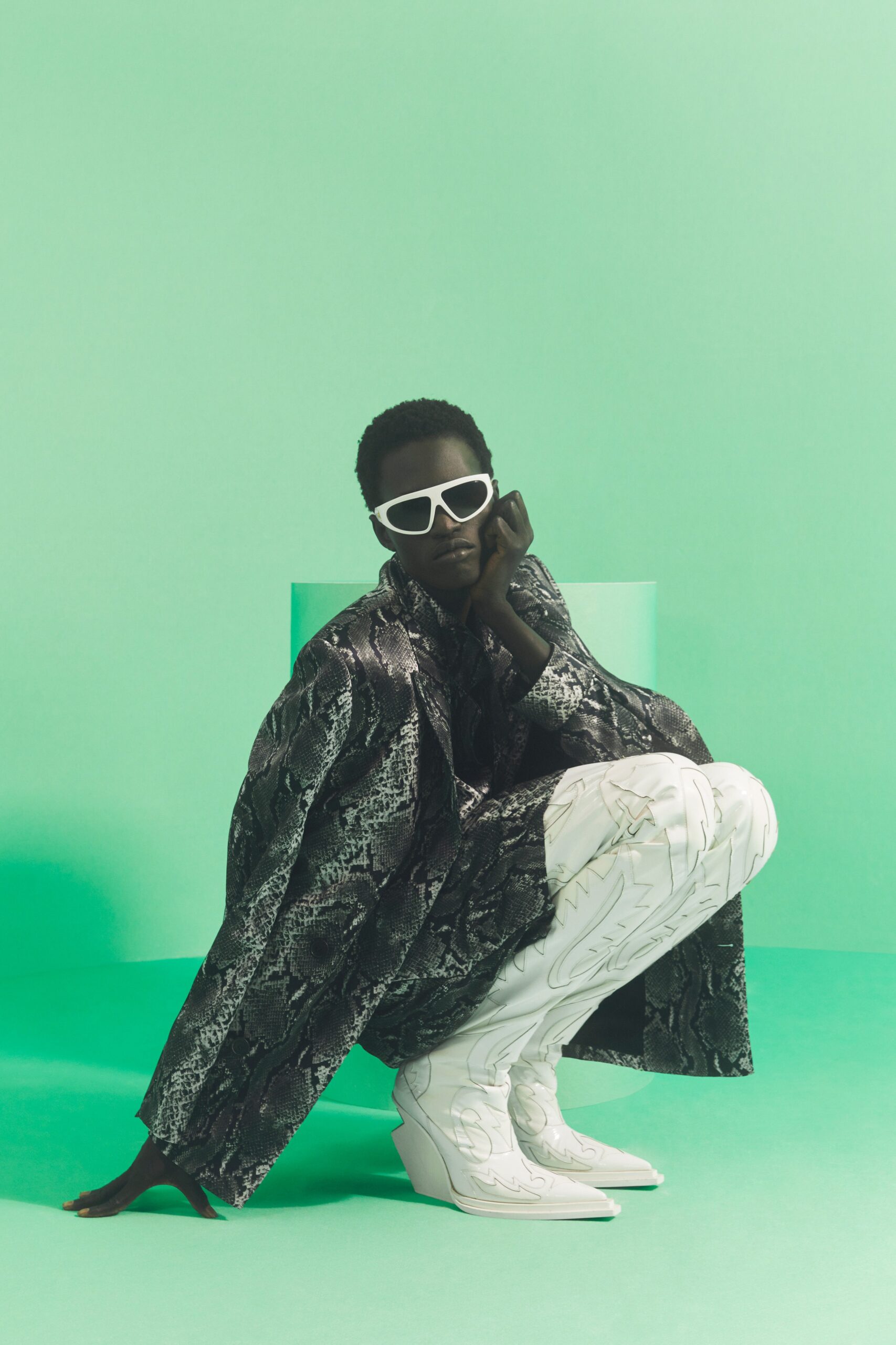 black and white printed coat with white boots