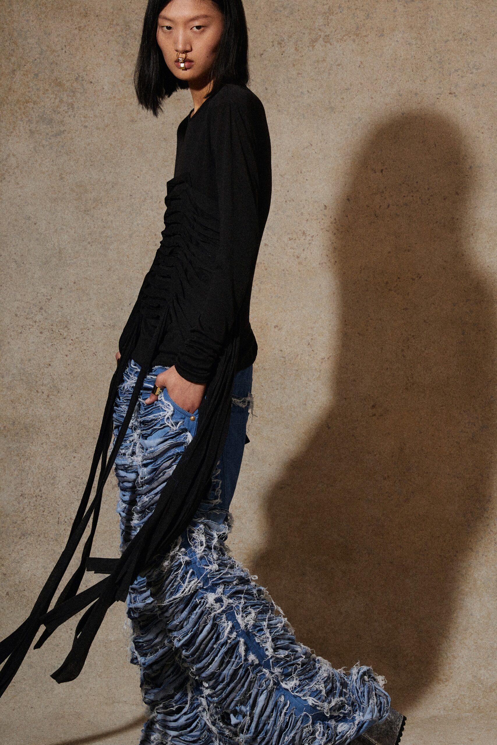 black fitted top with distressed jeans