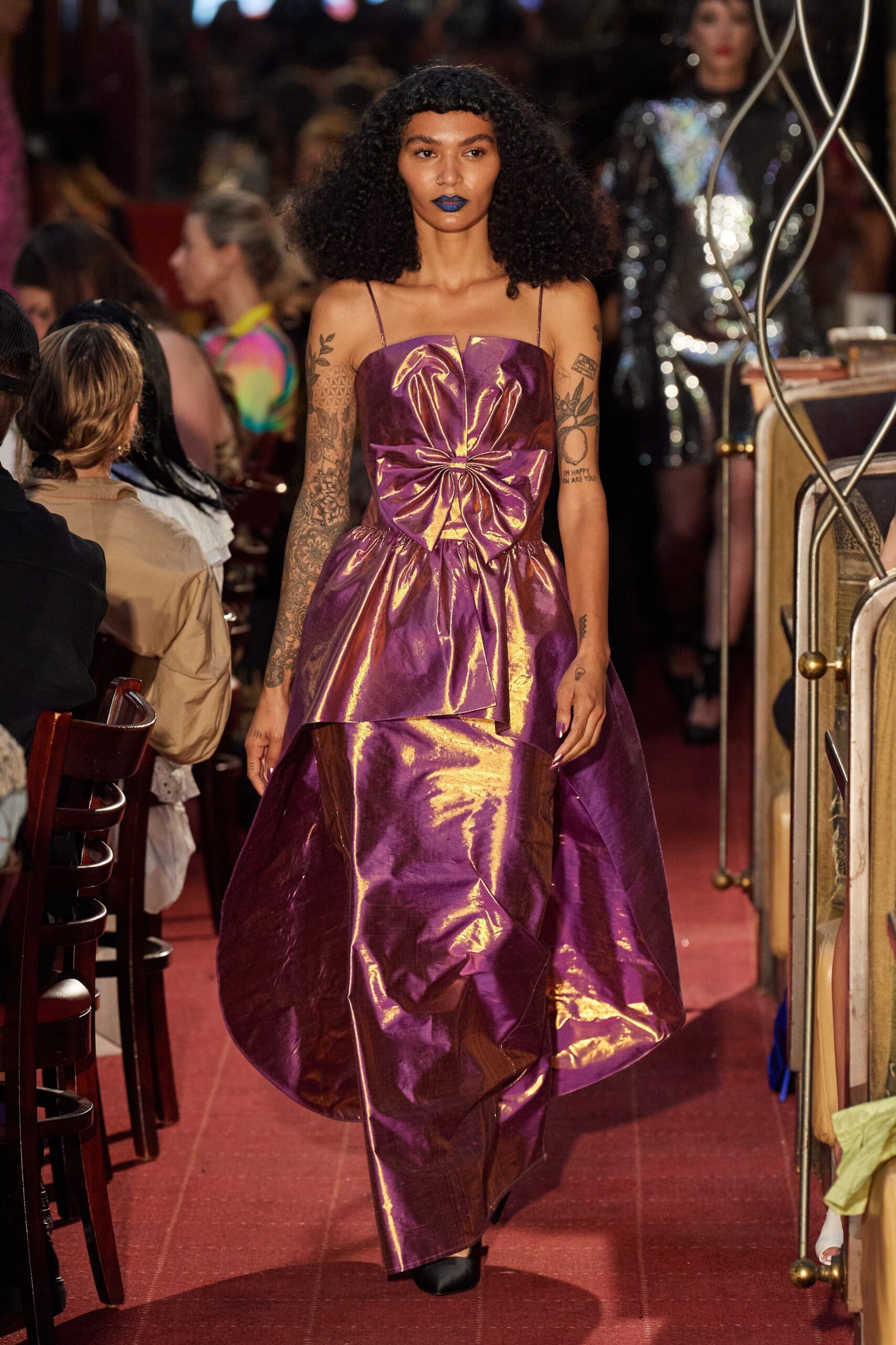 purple and gold draped dress