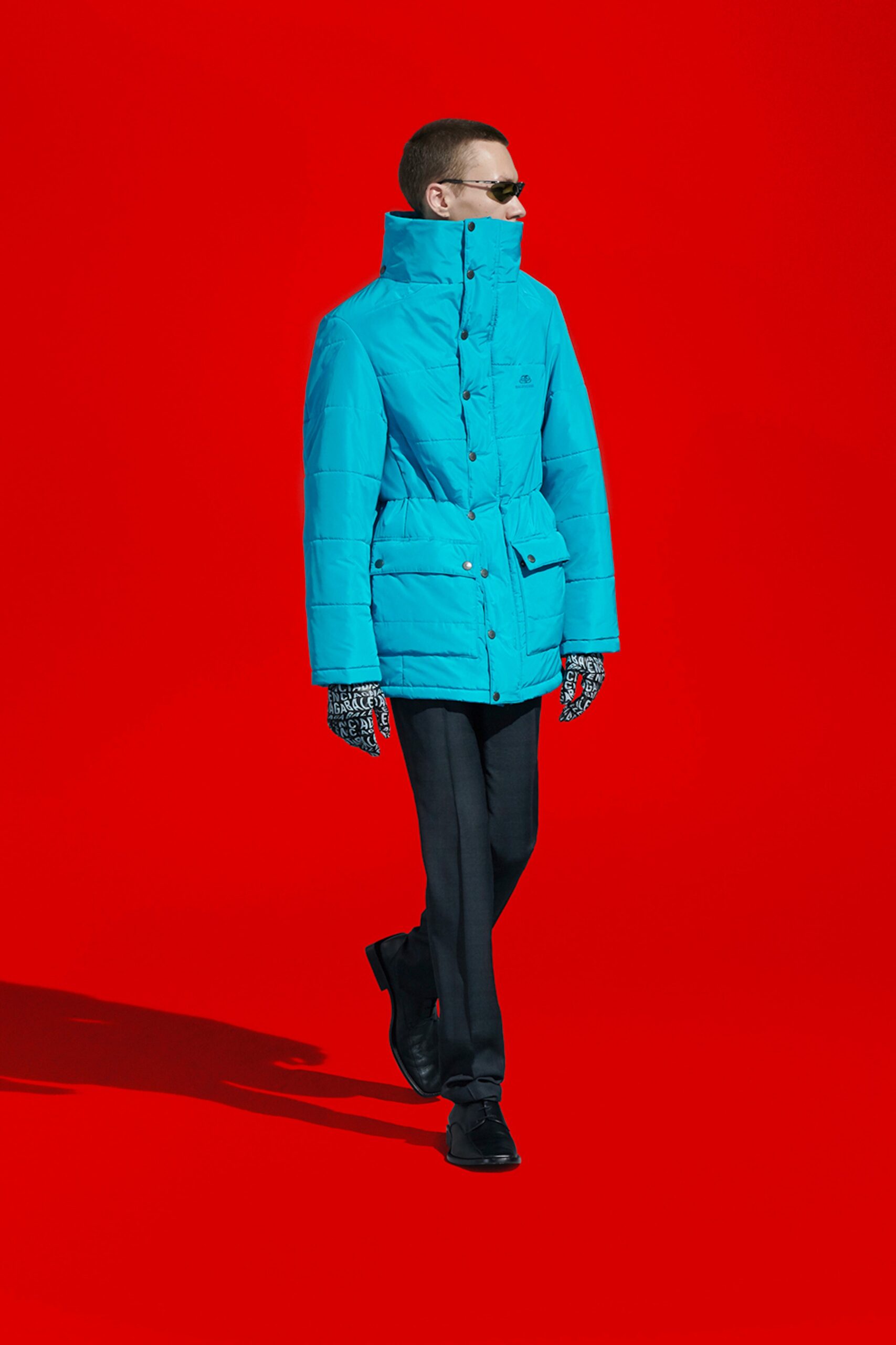 blue jacket with black pants