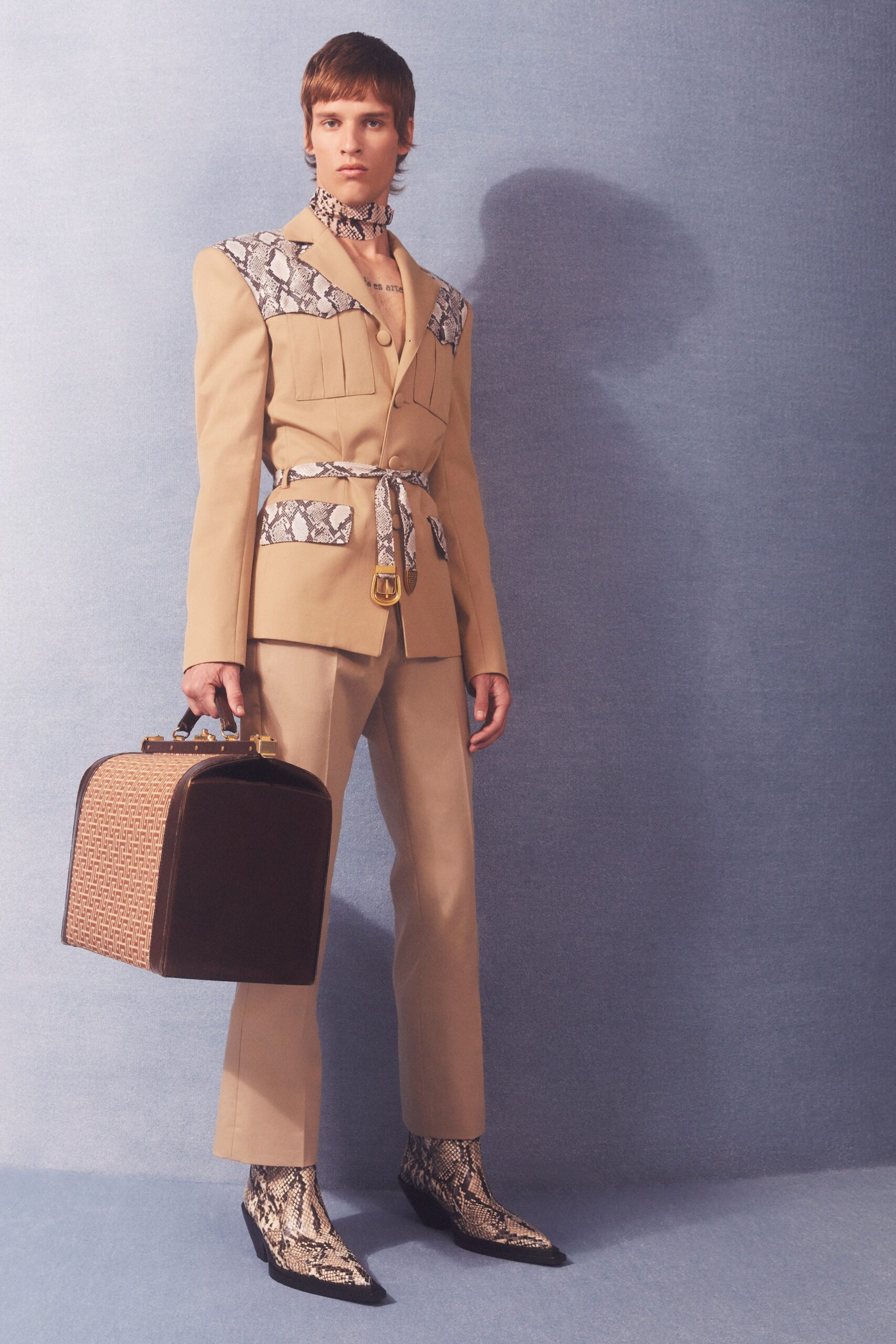 beige tailored suit with snake print