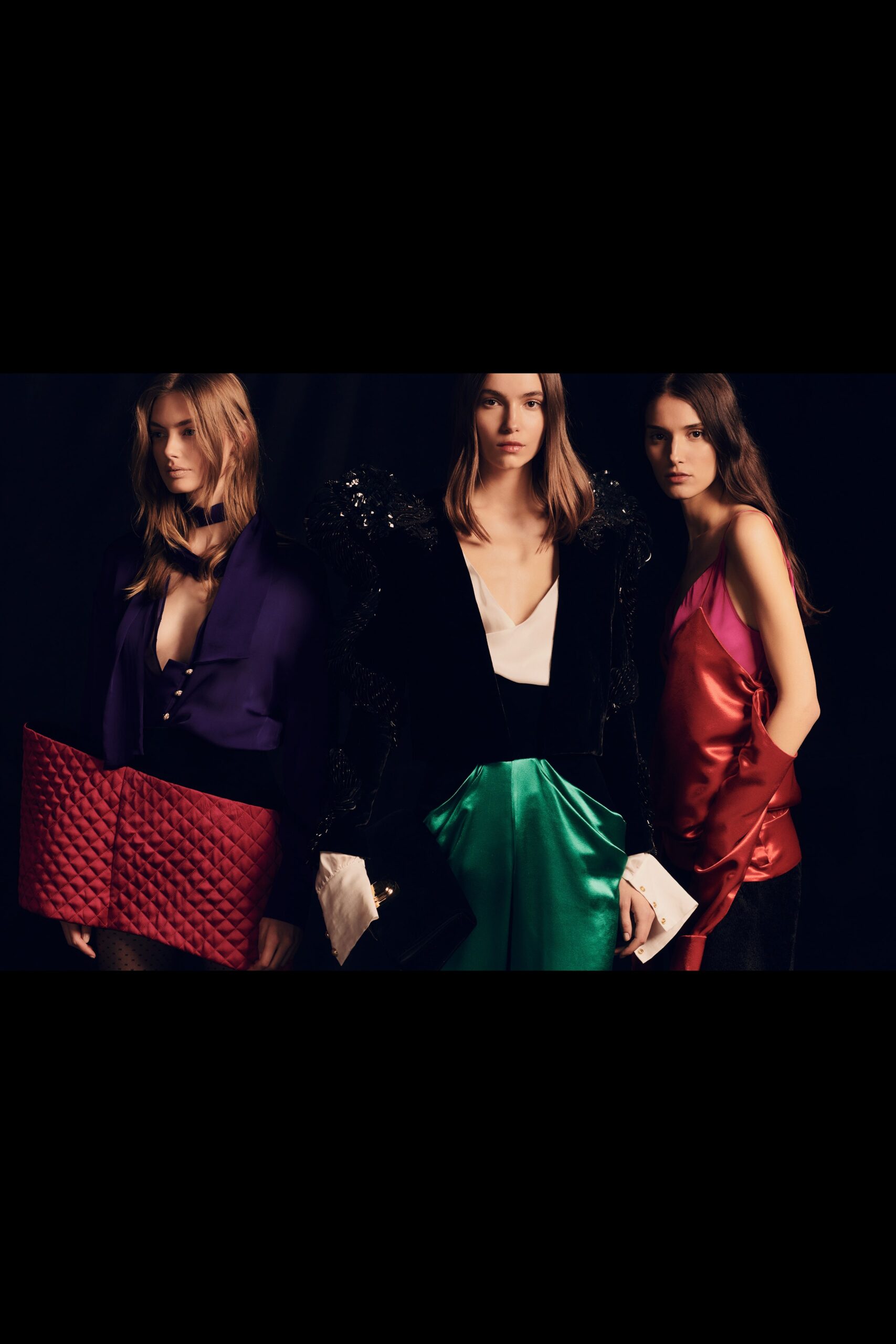 black silk sleeveless blouse with green skirt