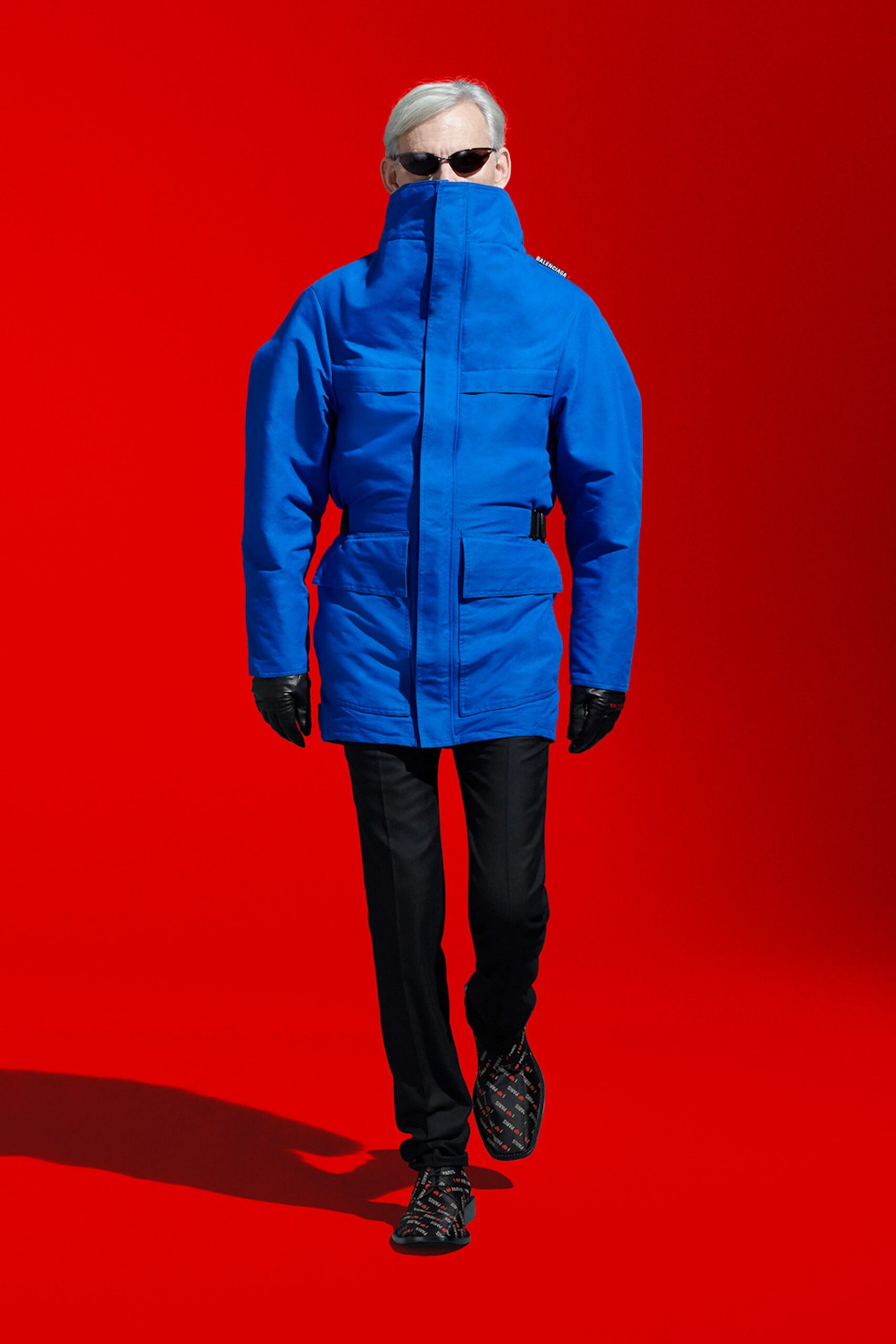 blue parka with black pants