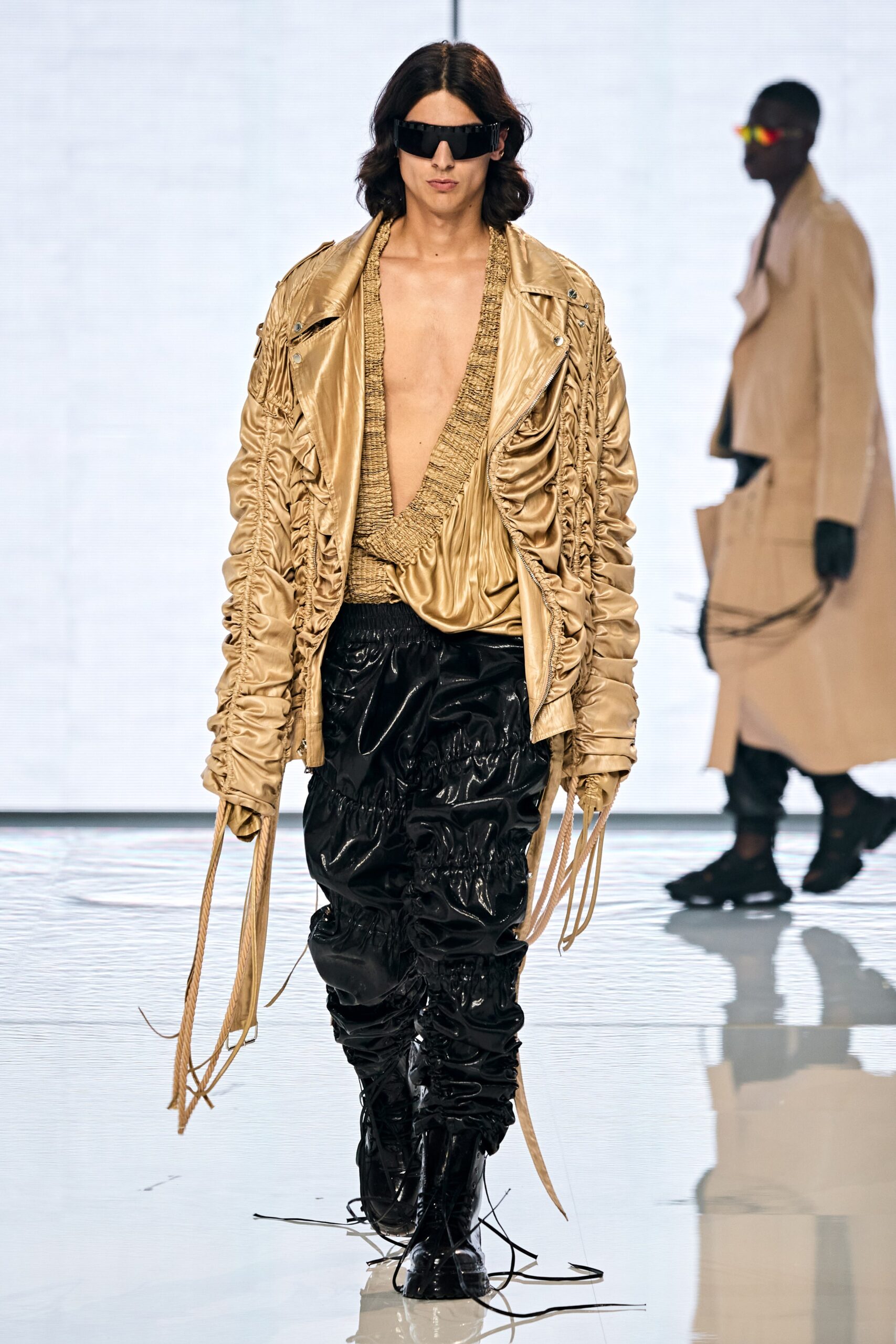 gold leather jacket with black pants