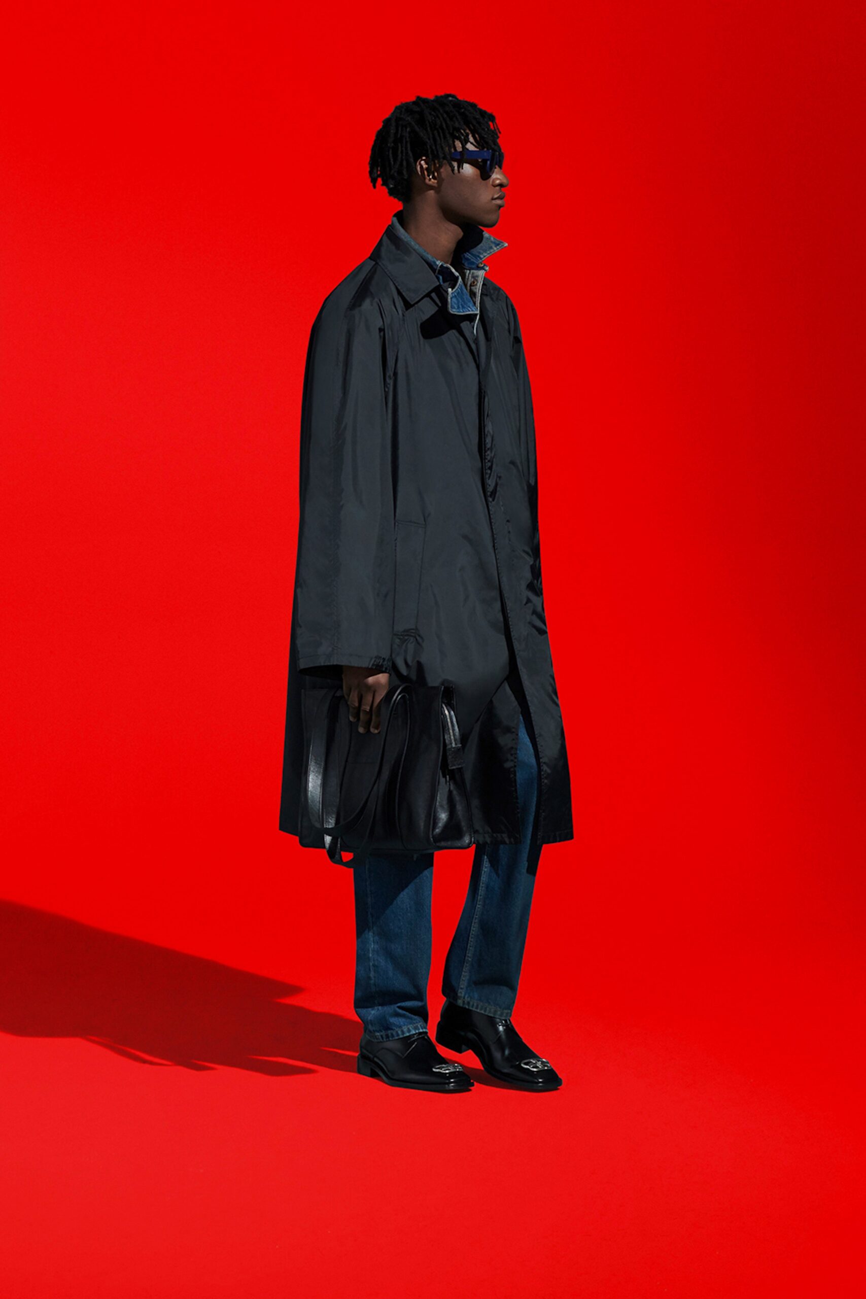 black vinyl coat with denim pants