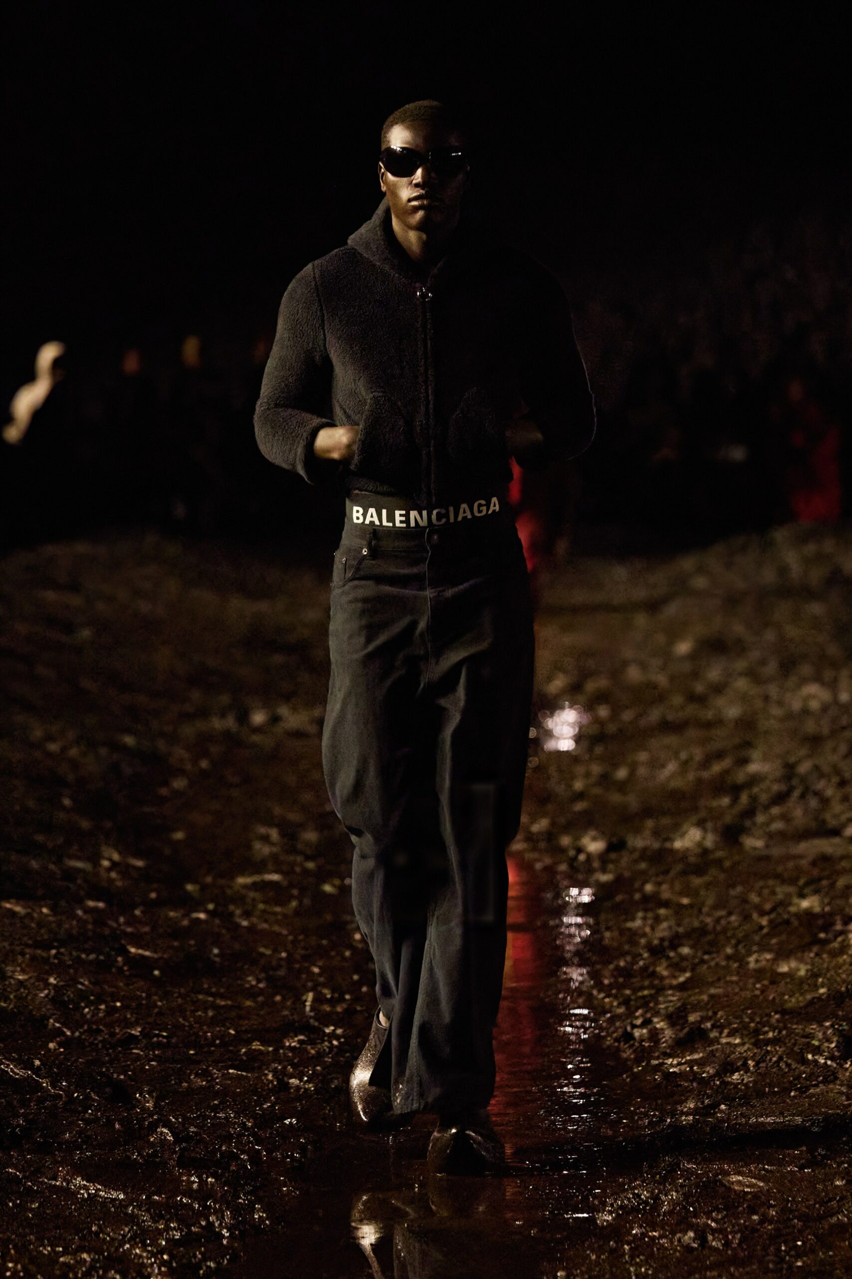 black fitted wool jacket with relaxed denim pants