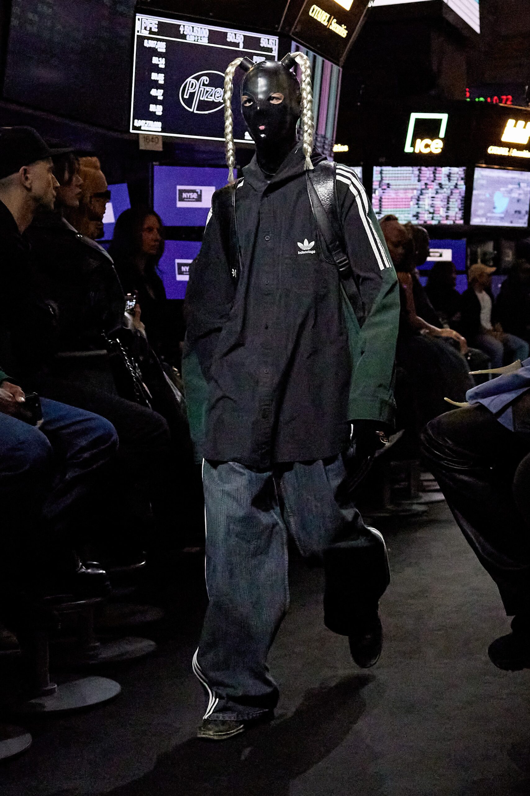 oversized black green jacket and relaxed blue pants
