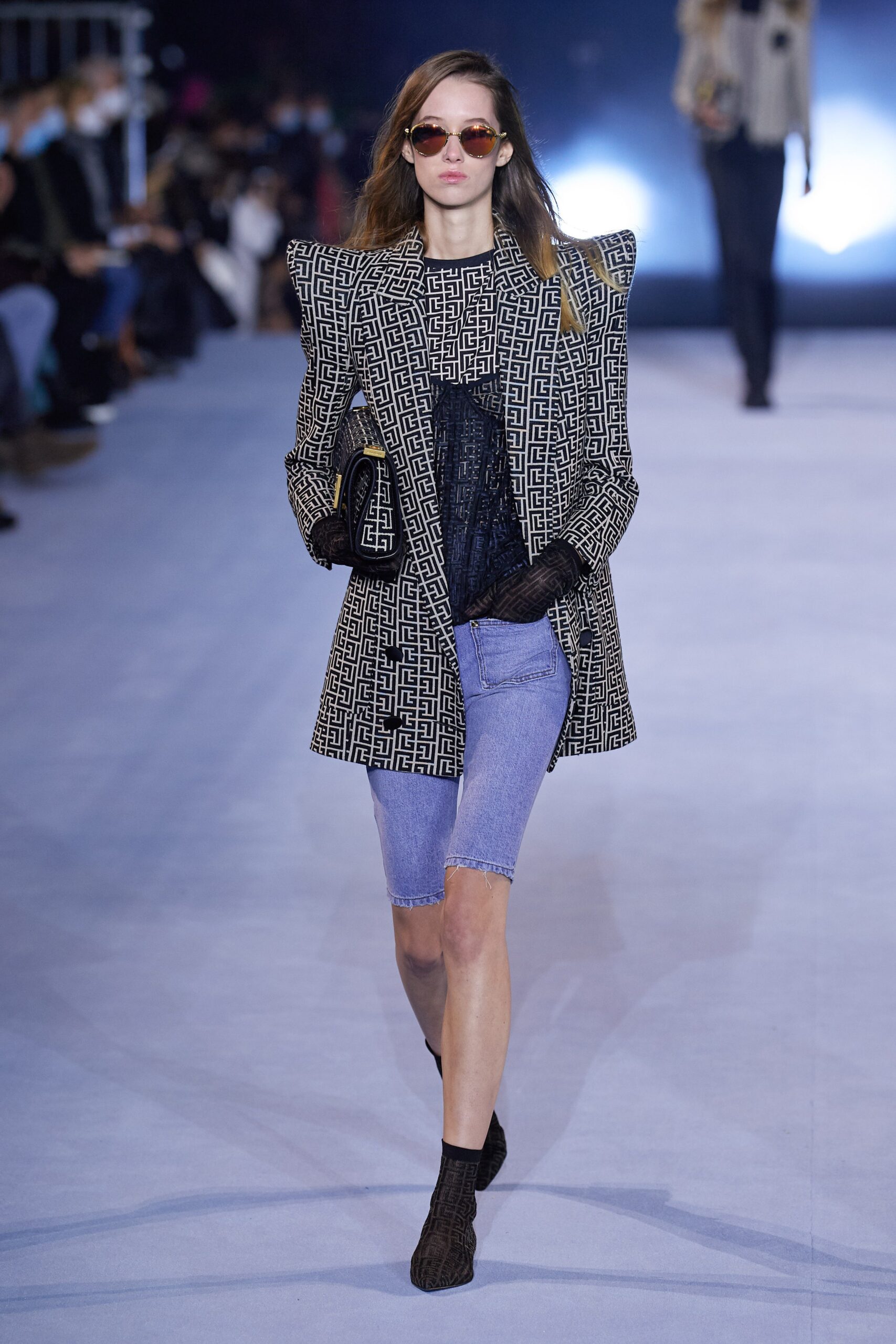 structured black and white jacket with denim shorts