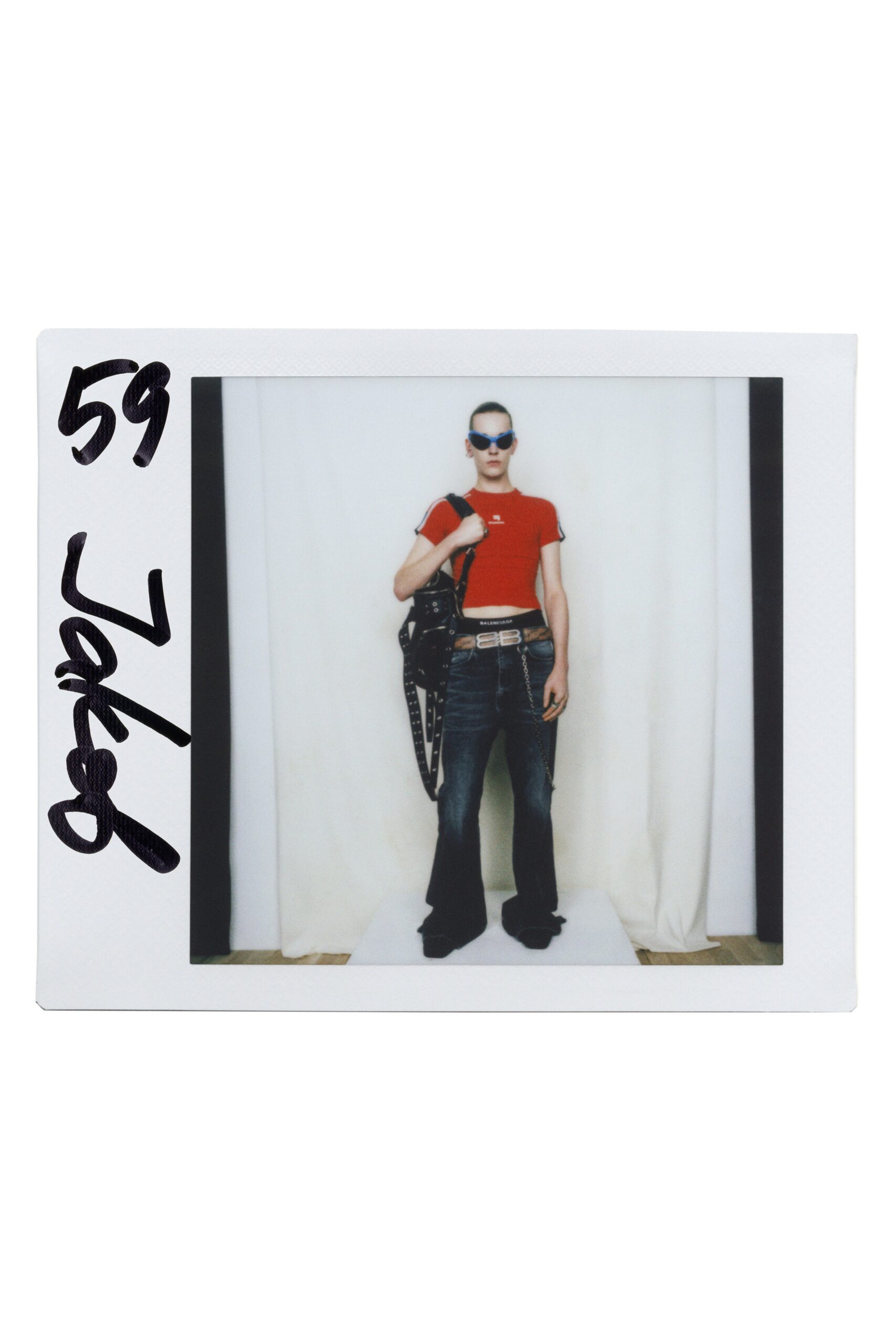 red fitted t-shirt with flared jeans