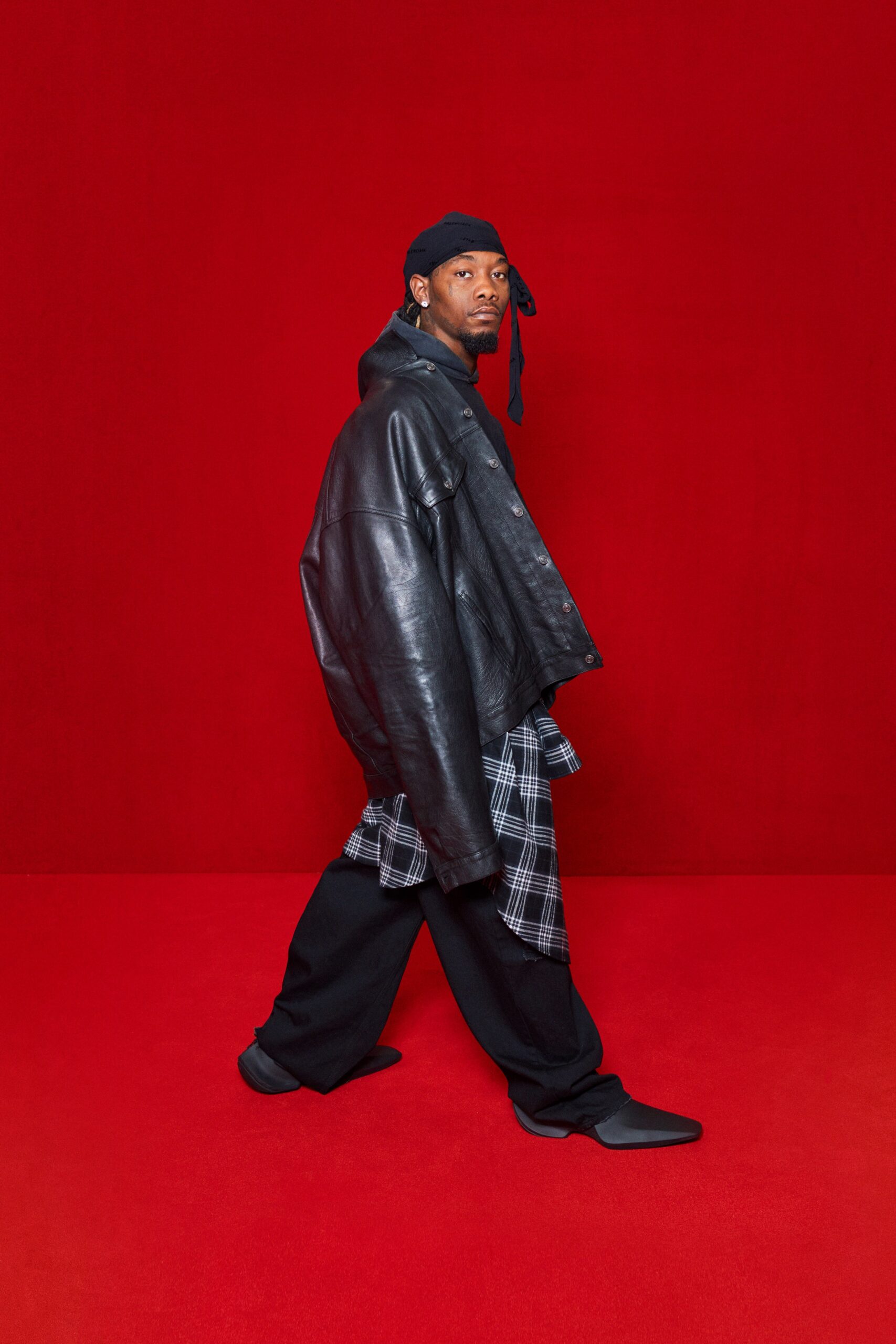 oversized black leather jacket with checked shirt