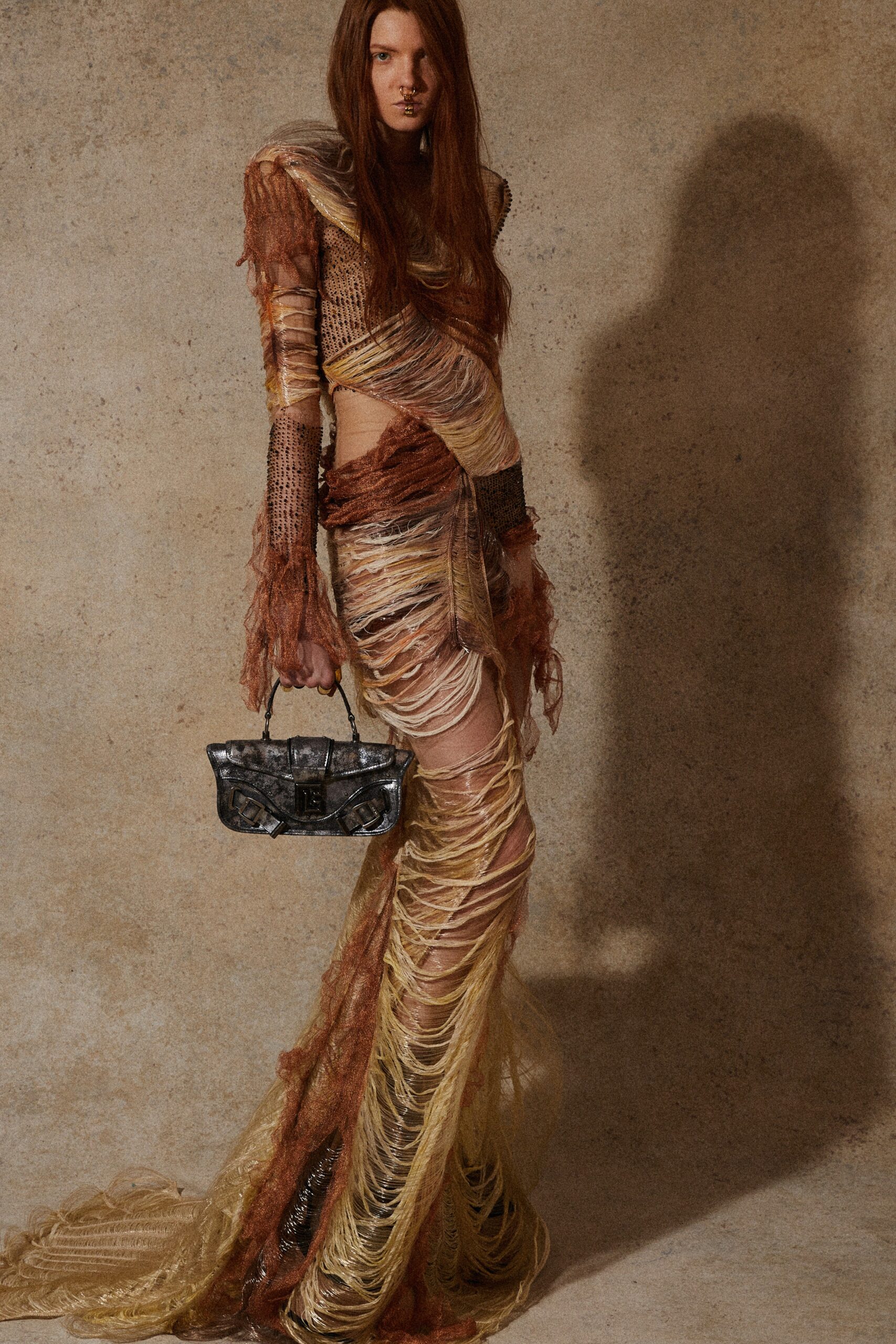 brown and gold layered maxi dress with bag