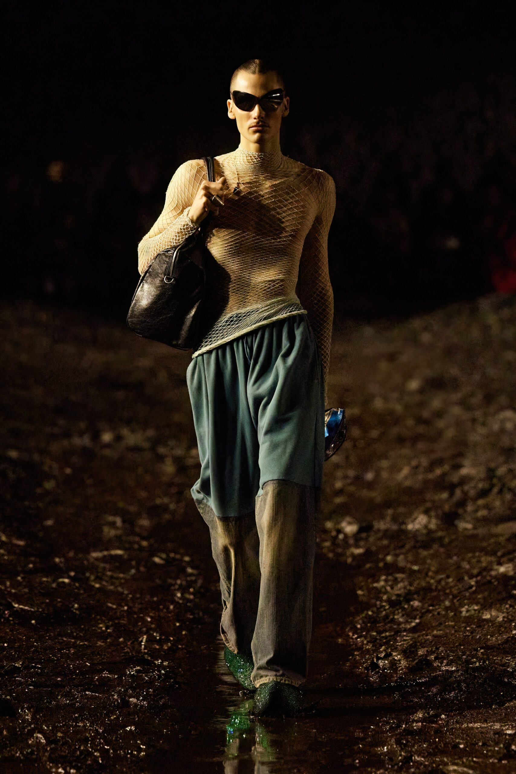 beige mesh fitted top and blue relaxed pants