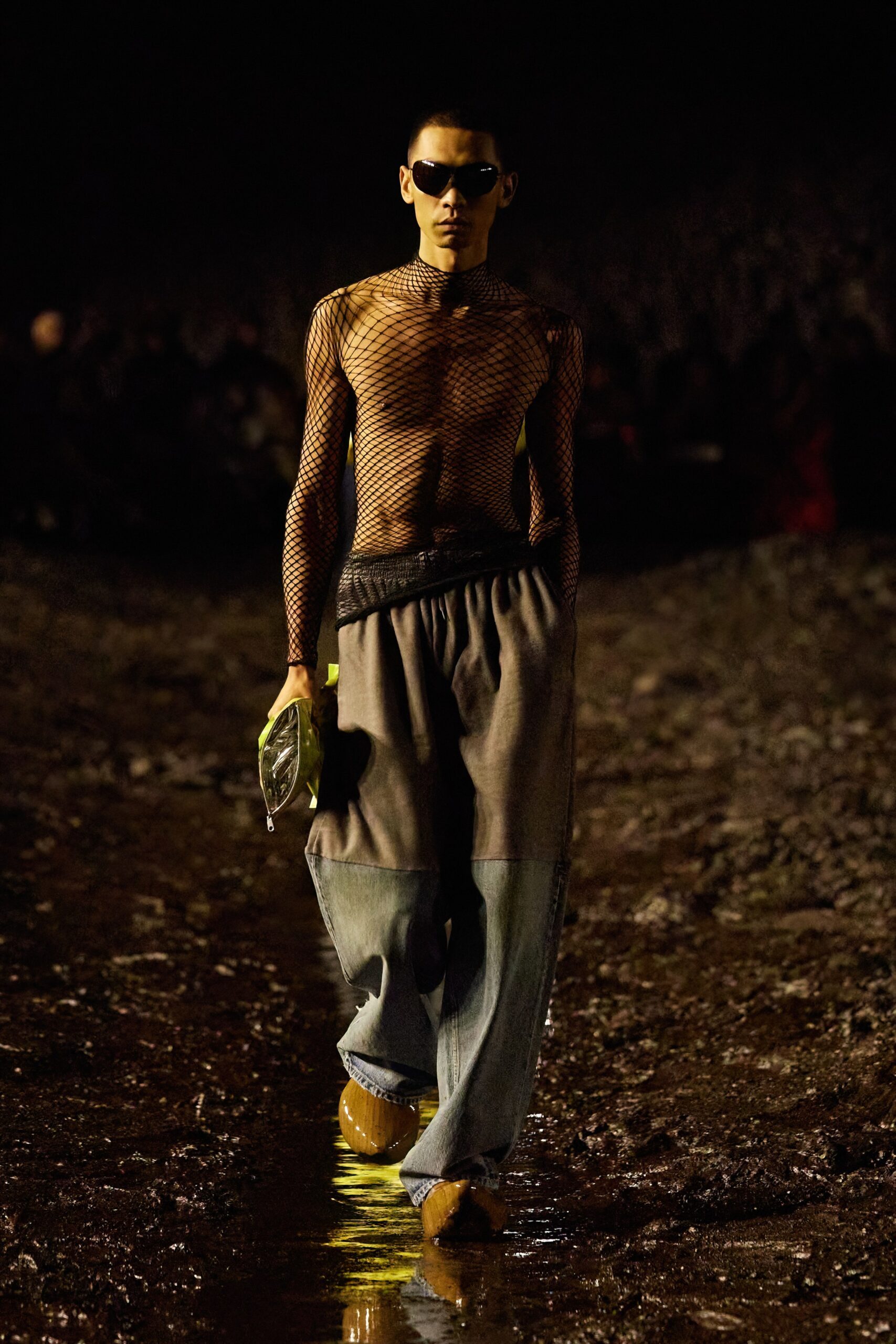 black mesh top with relaxed denim pants