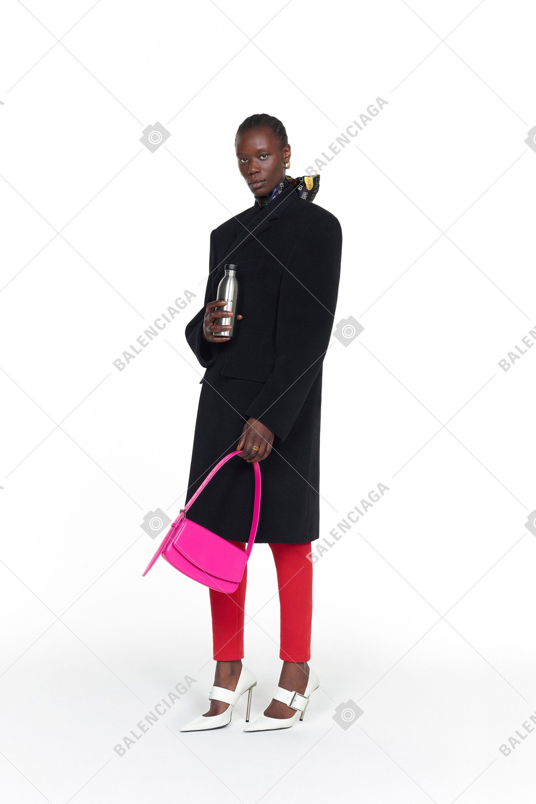 black oversized coat with red pants