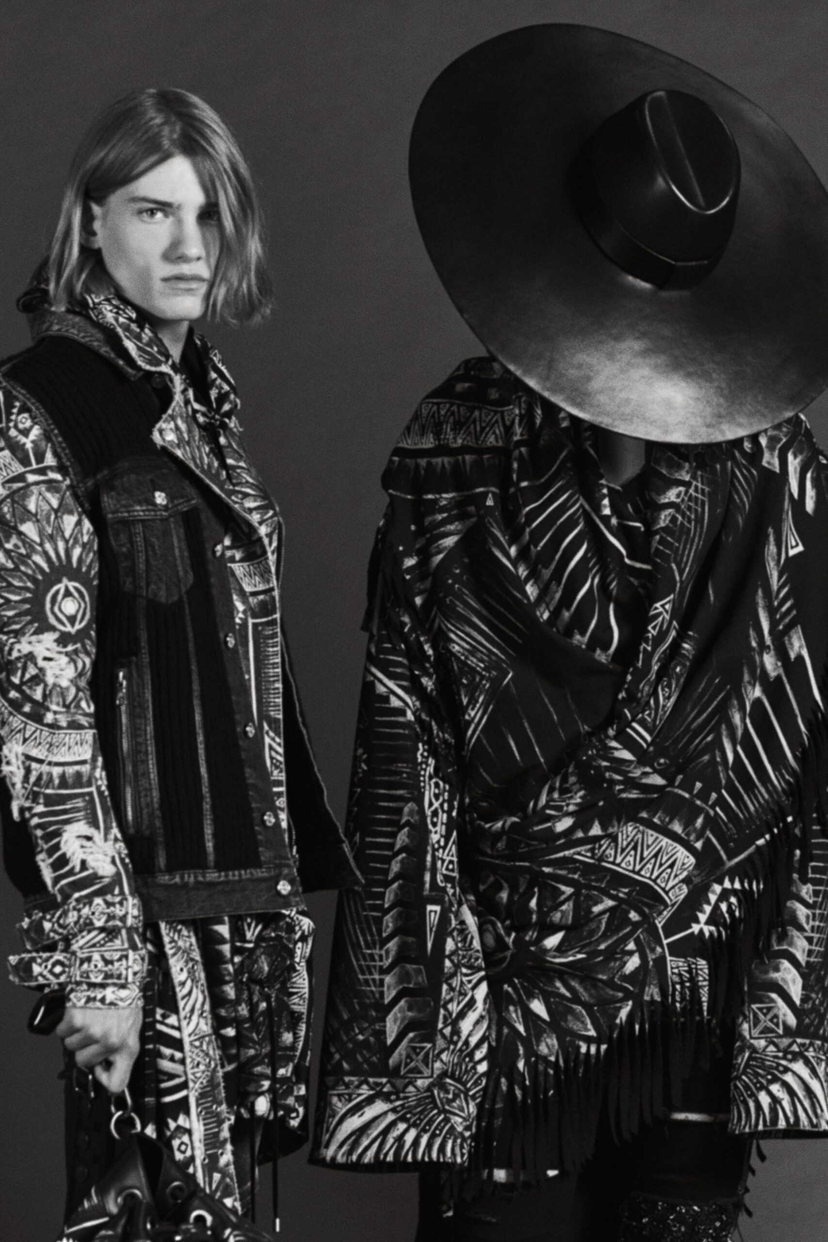 black and white denim jacket with fringed cape