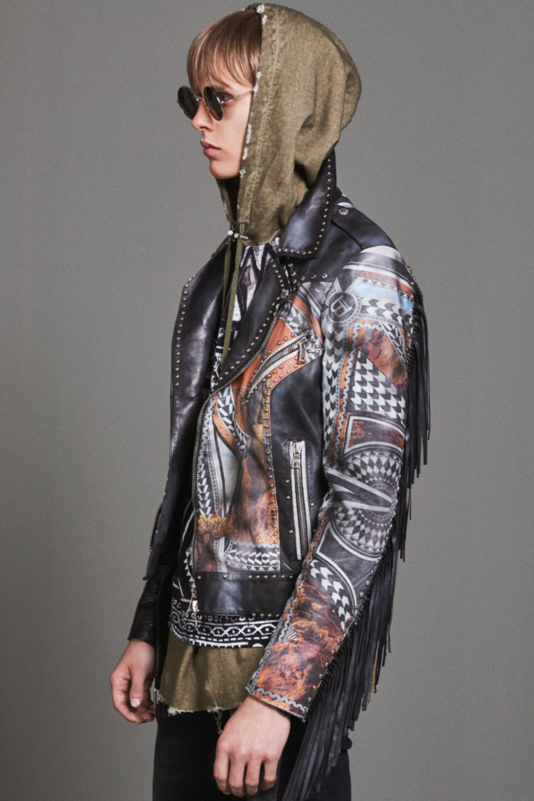 black leather fringed jacket and olive hoodie