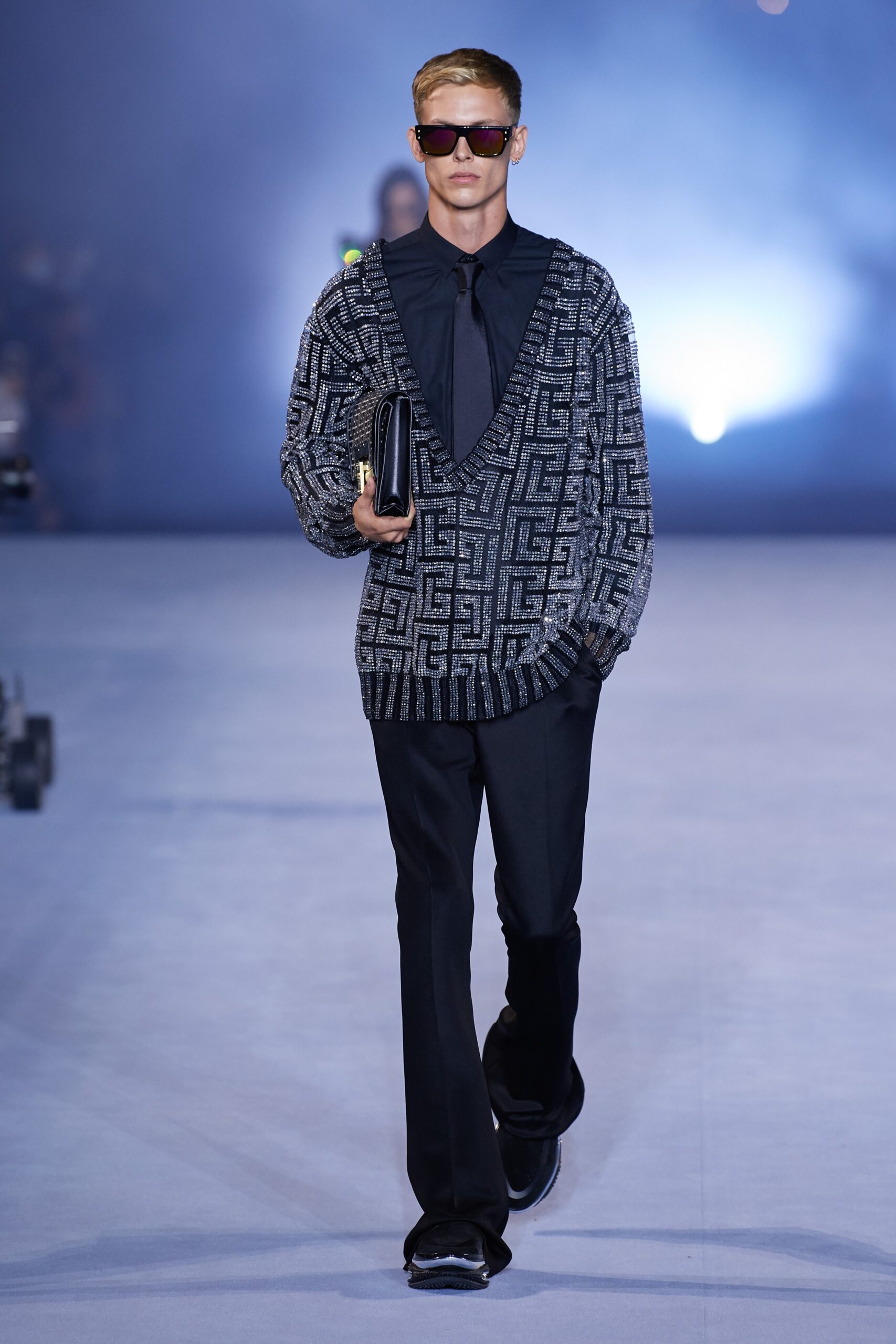 fitted black knit sweater with tailored pants