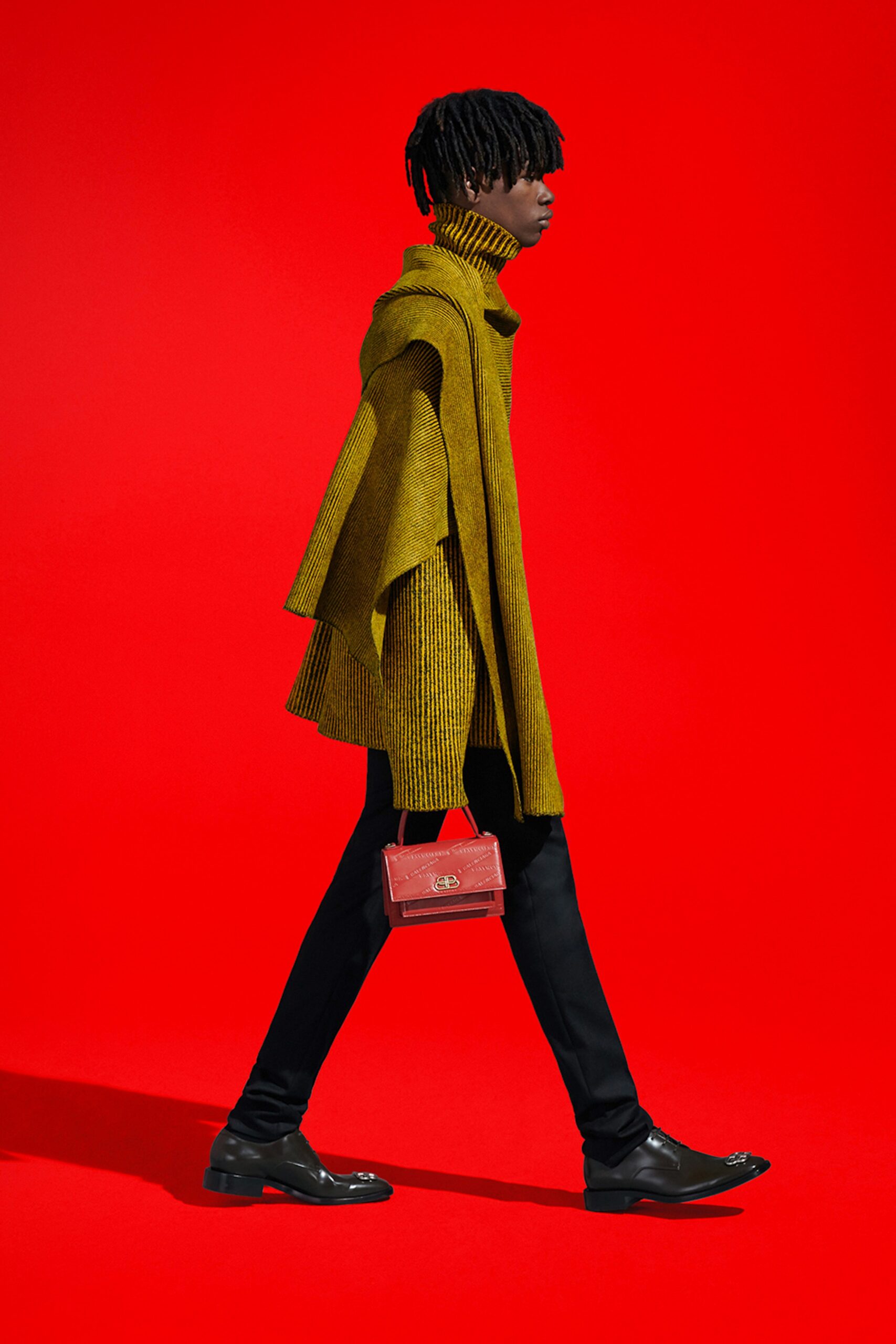 green wool poncho with black pants