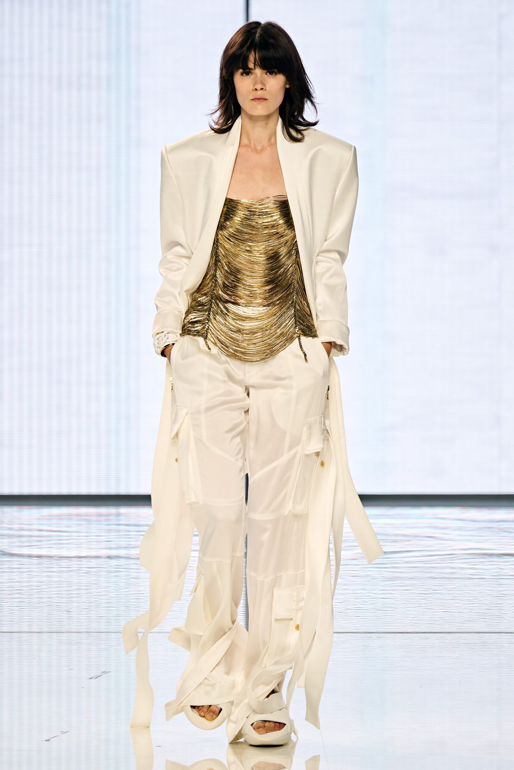 gold ruched top with white blazer