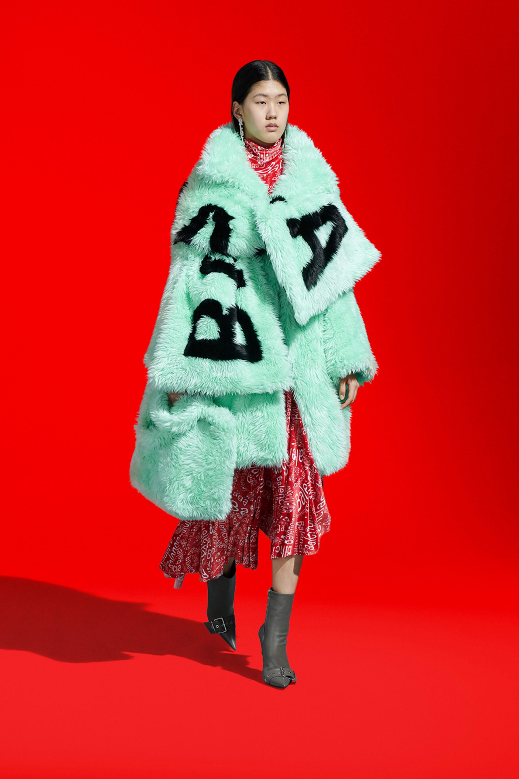 red silk midi dress with oversized green coat